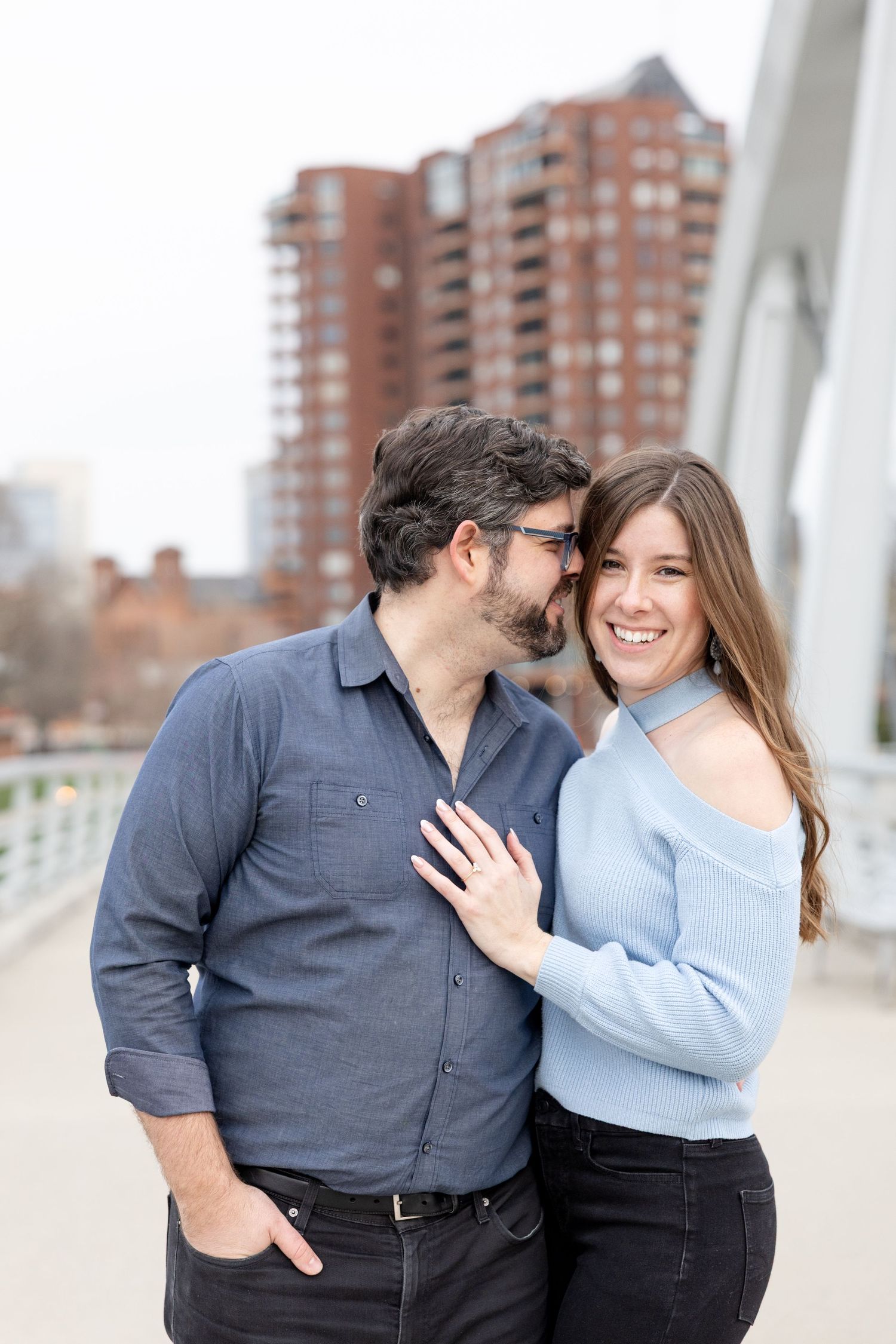 Downtown Columbus engagement photos on Main Street Bridge with a joyful couple in a light and airy style