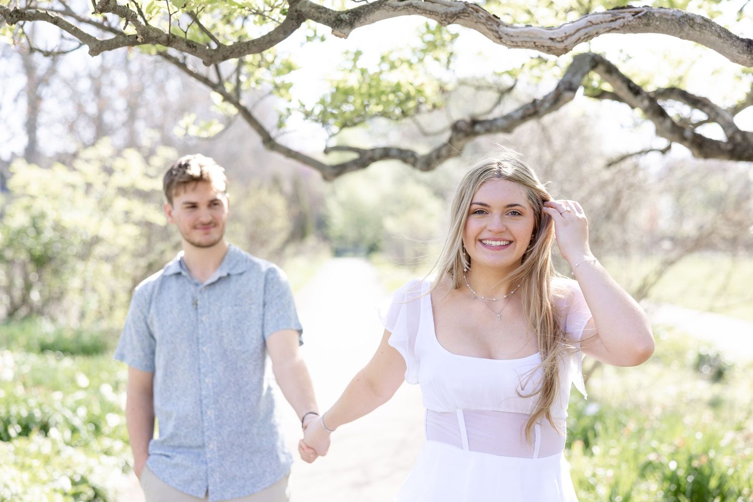 Cincinnati engagement session at Ault Park with light and airy style, capturing joyful, natural moments in a spring park setting