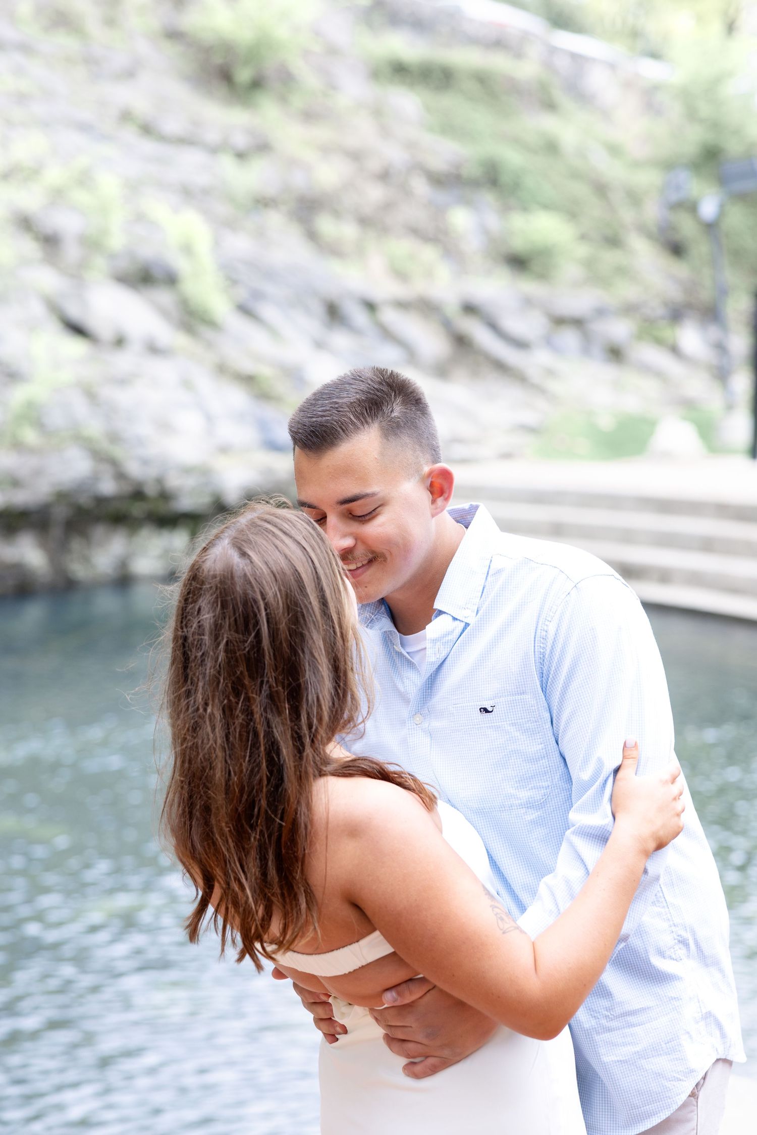 Downtown Huntsville engagement session at First National Bank and Big Spring Park by Julia and Sean Photography, capturing joyful moments.