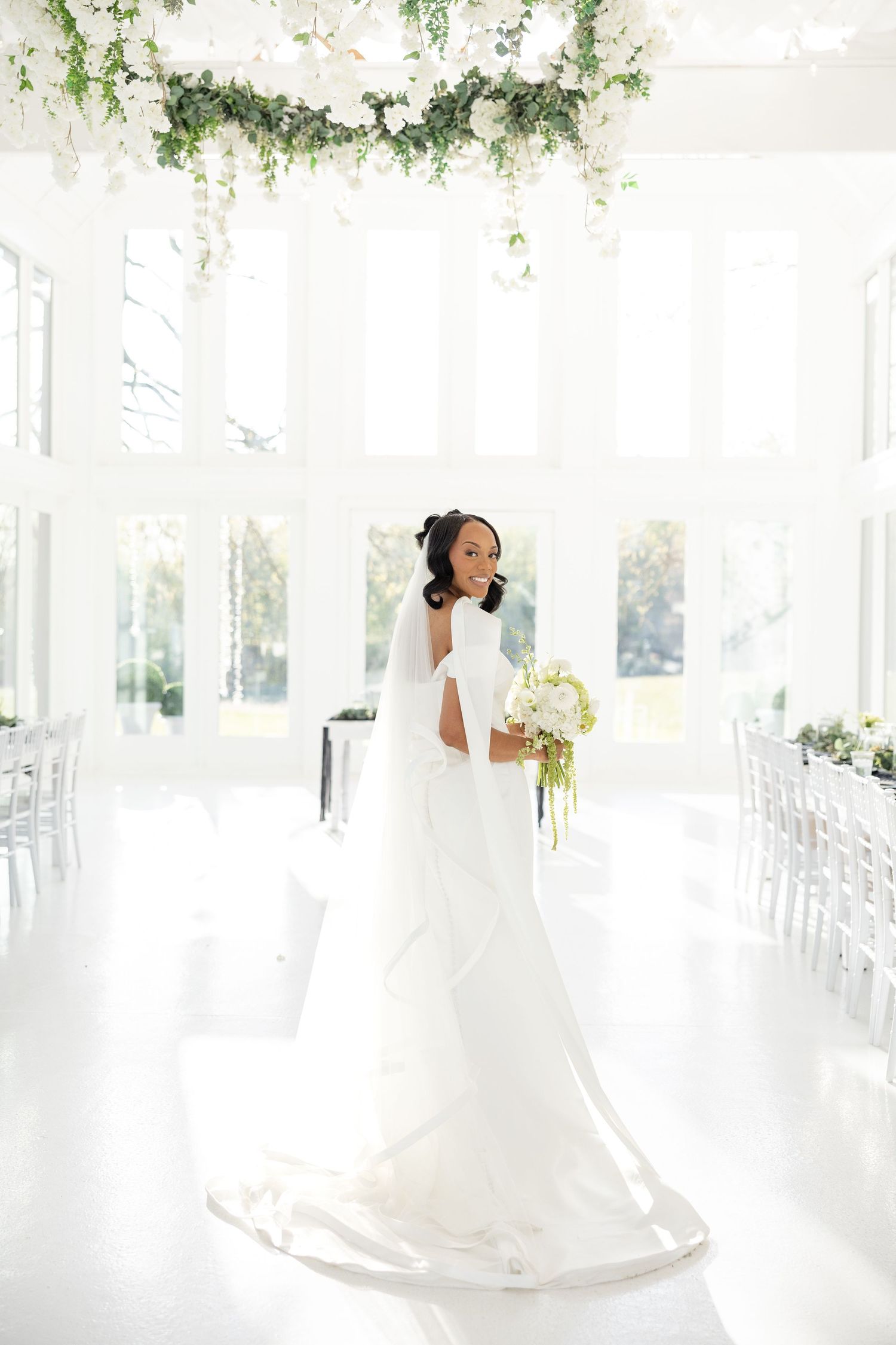 Light and airy wedding photos at The Glass House near Huntsville, Alabama capturing joyful, timeless moments of a bride and groom