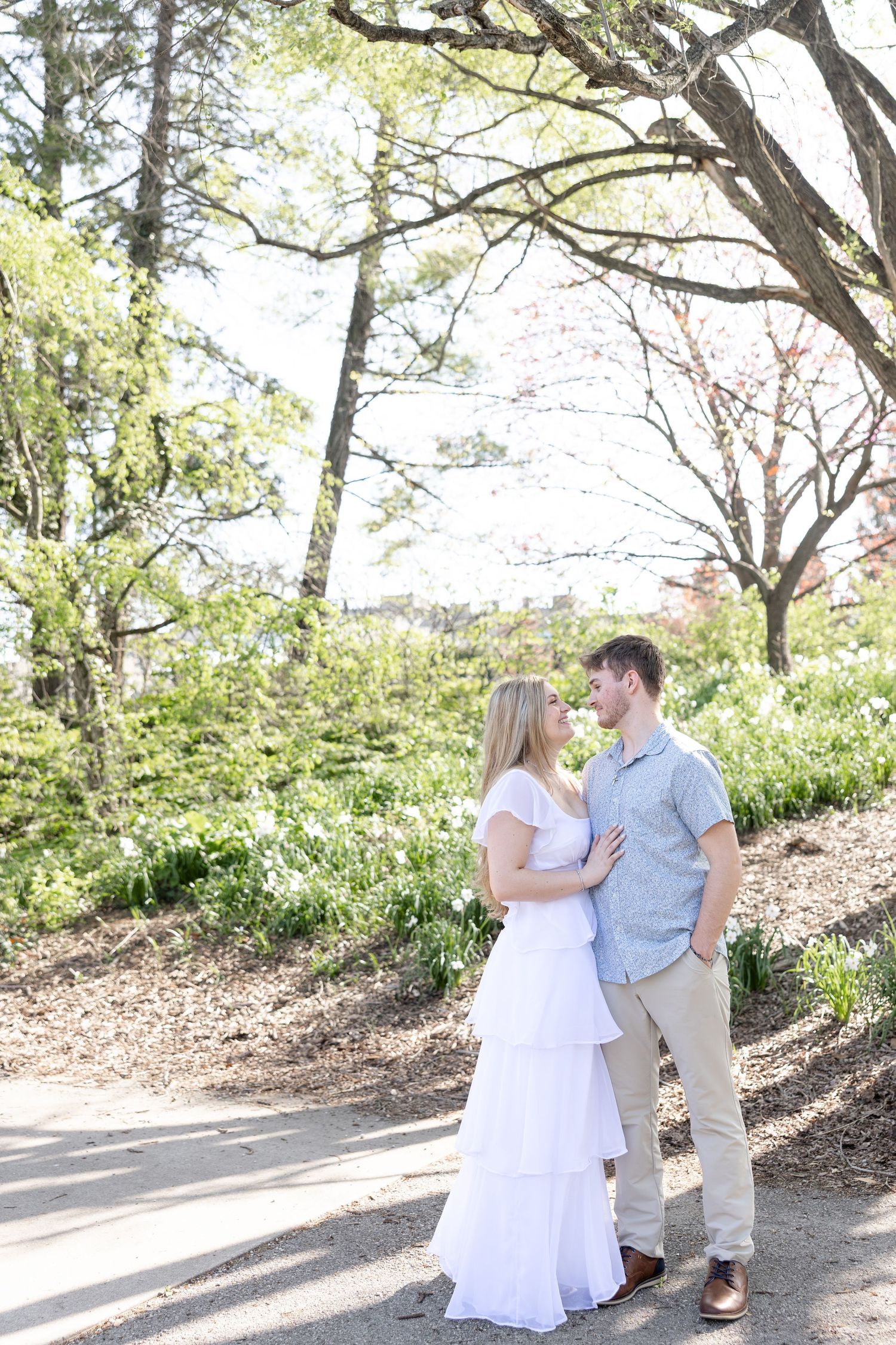 Cincinnati engagement session at Ault Park with light and airy style, capturing joyful, natural moments in a spring park setting
