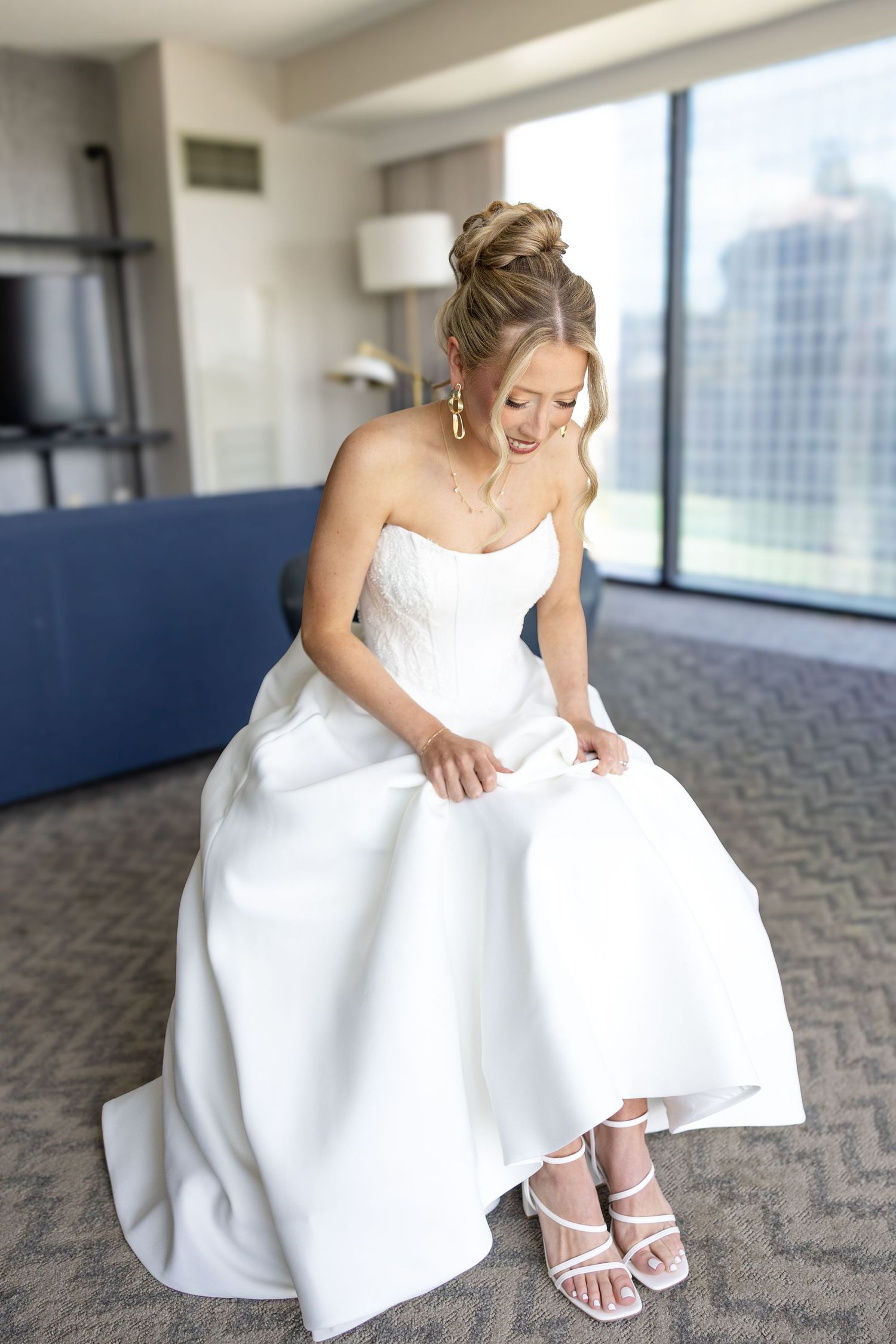 Getting ready photos at The Renaissance Hotel in downtown Toledo before a joyful Toledo Zoo wedding photographed by Julia & Sean Photography