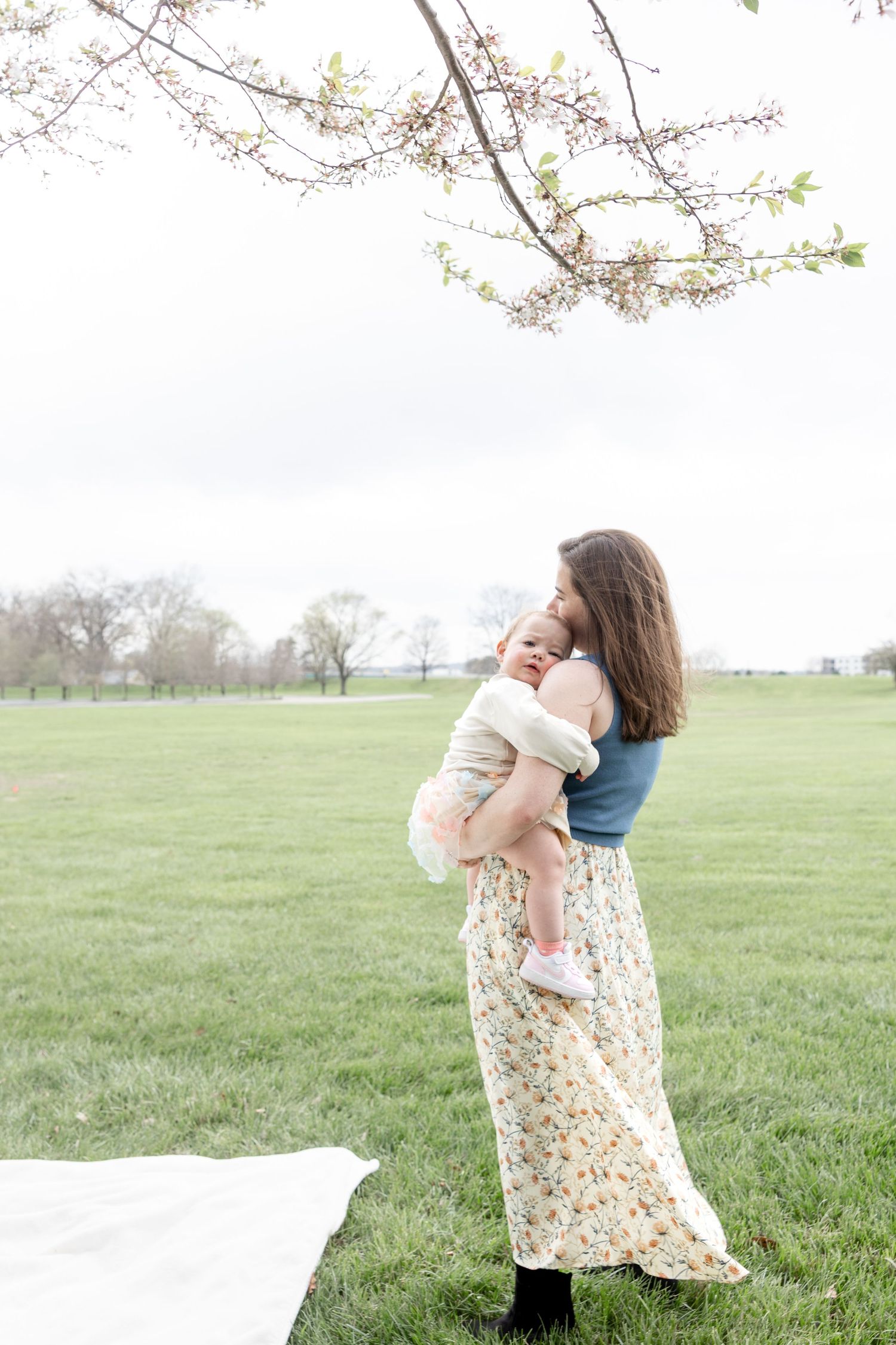 Mother holding her baby during a timeless motherhood session at Carillon Park in Dayton Ohio with Julia and Sean Photography