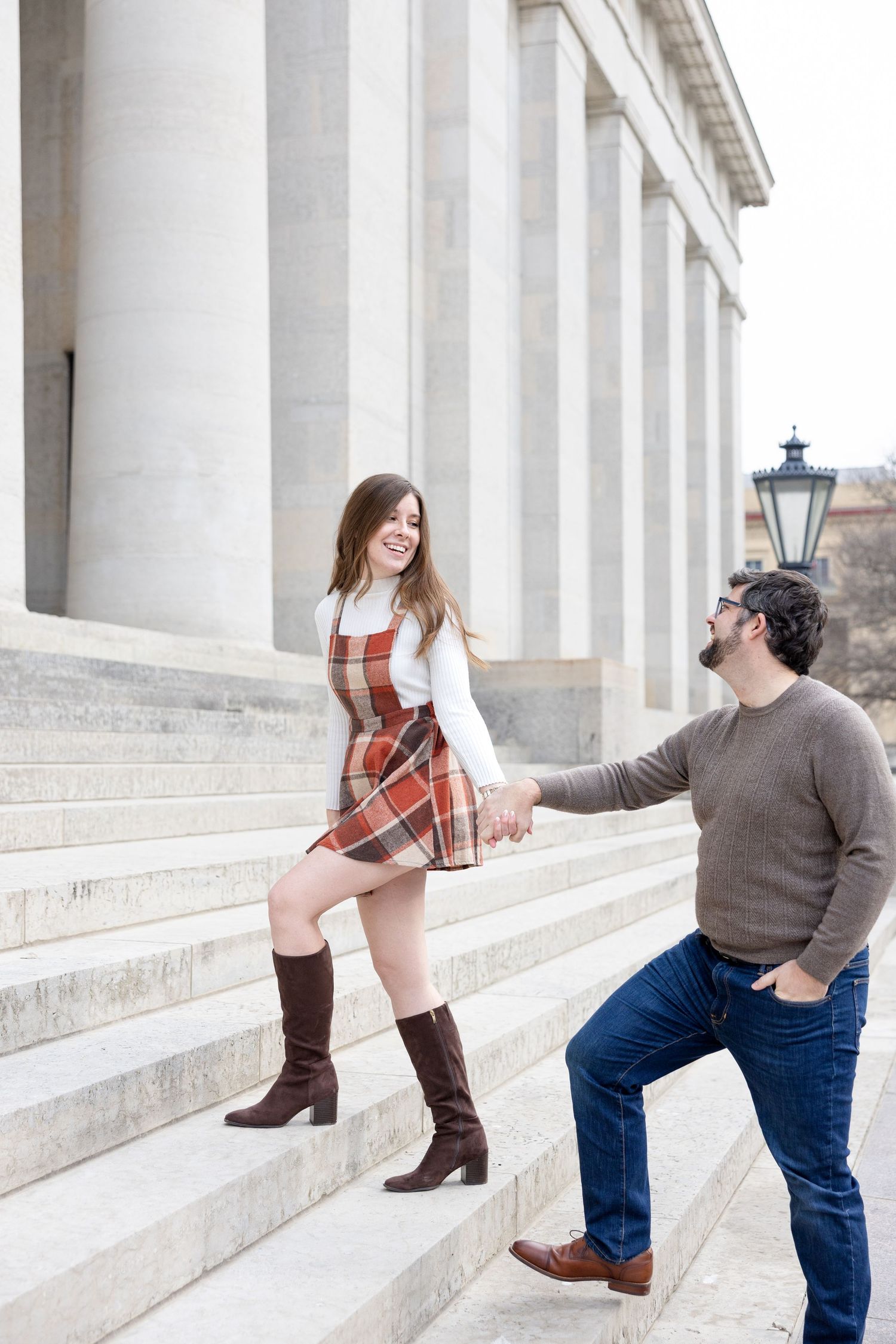 Ohio Statehouse engagement photos in downtown Columbus Ohio with a joyful couple in a light and airy style