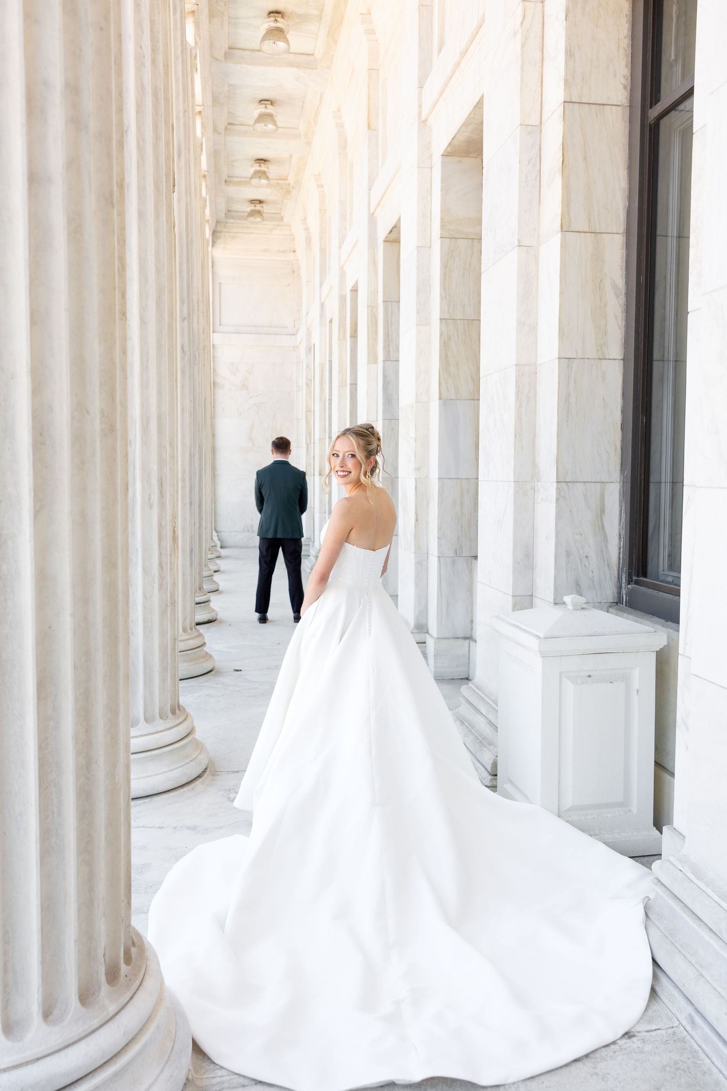 Bride and groom portraits at the Toledo Museum of Art before a Toledo Zoo wedding in Toledo, Ohio photographed by Julia & Sean Photography