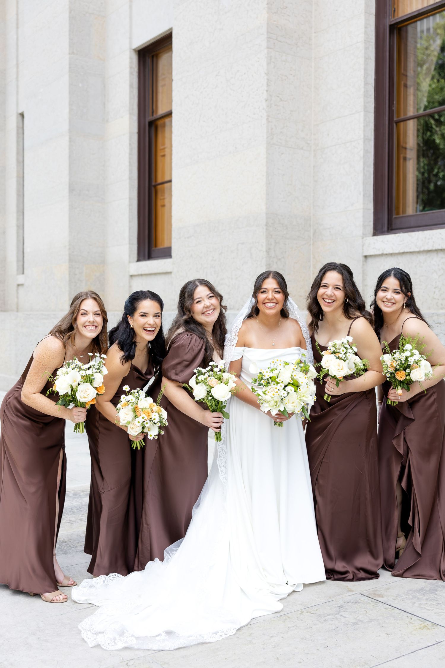 Bride and groom celebrating their Flat 51 wedding in downtown Columbus, Ohio, captured with timeless, light and airy wedding photography.