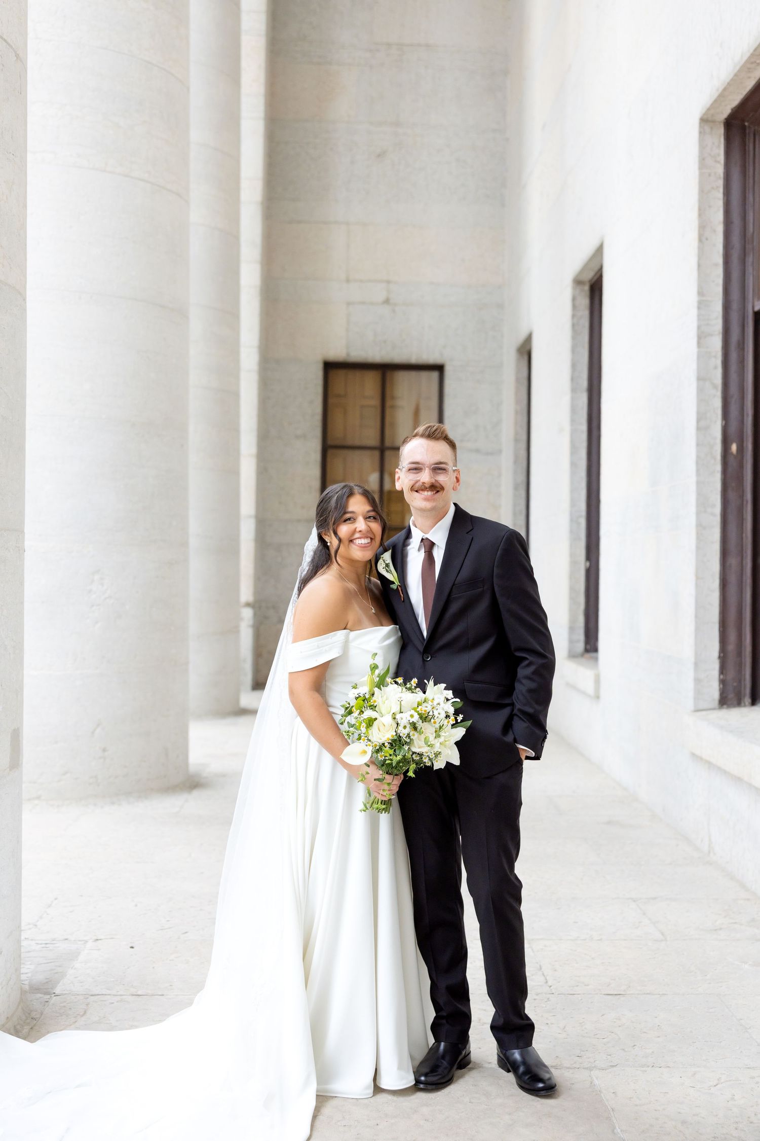 Bride and groom portraits at the Ohio Statehouse in downtown Columbus, Ohio, captured with timeless, light and airy wedding photography.