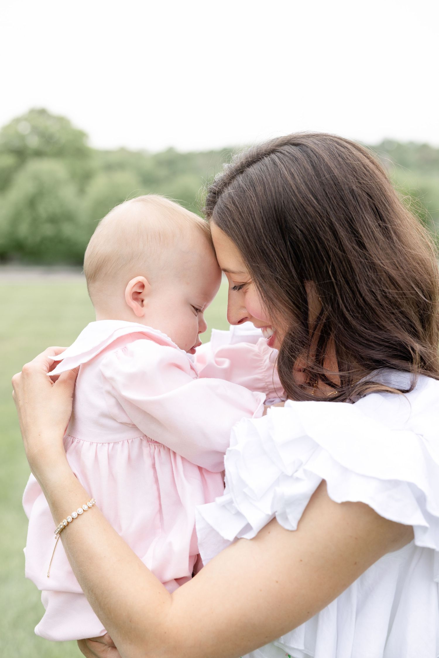 Joyful motherhood photos at Carillon Park in Dayton Ohio captured by Julia and Sean Photography during a soft spring day