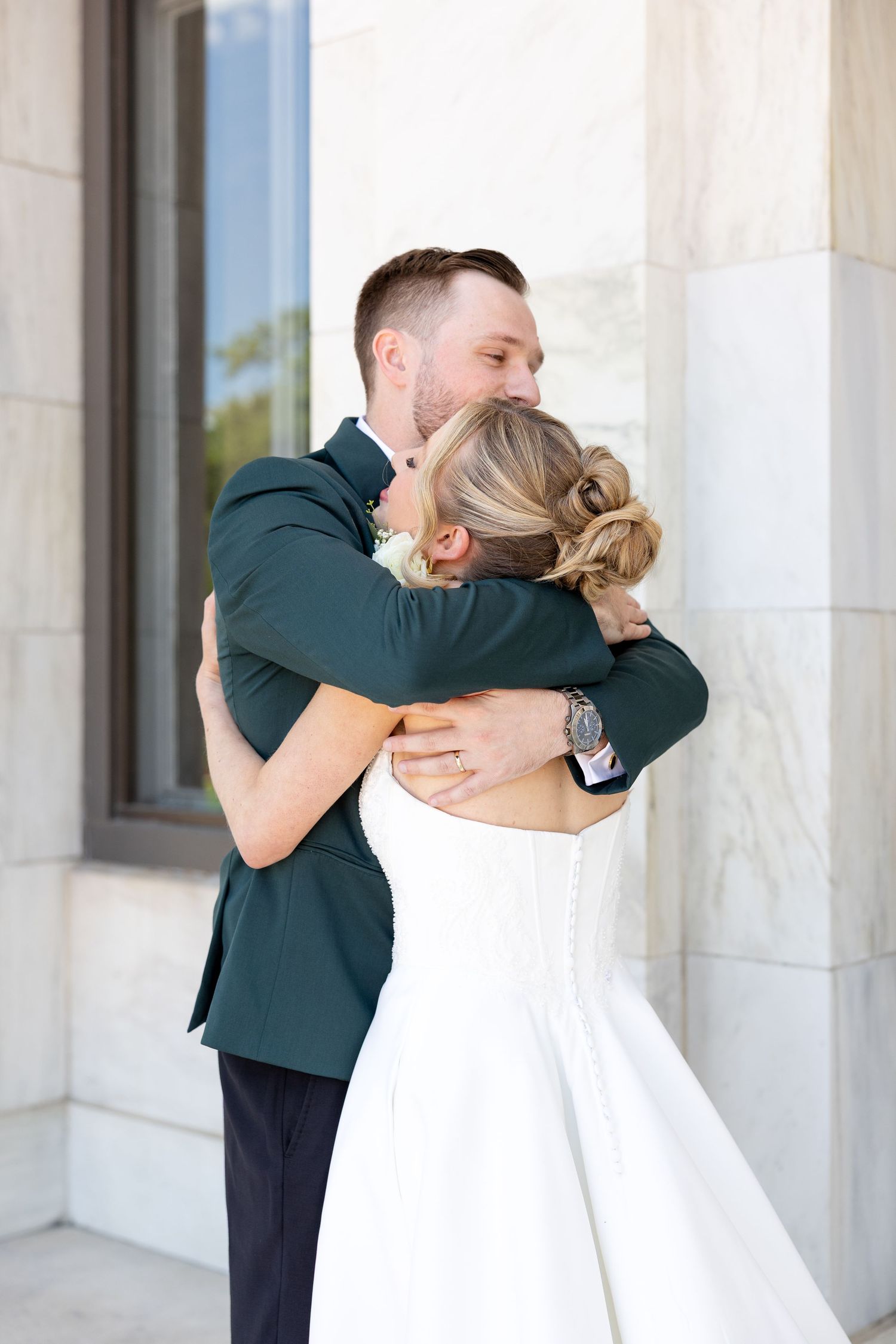 Bride and groom portraits at the Toledo Museum of Art before a Toledo Zoo wedding in Toledo, Ohio photographed by Julia & Sean Photography