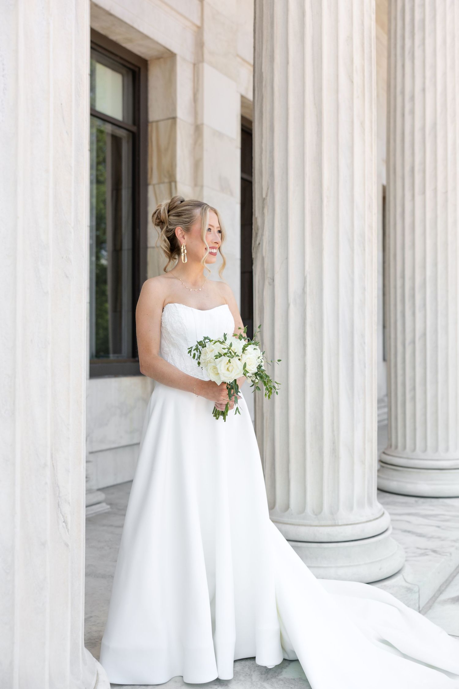 Bride and groom portraits at the Toledo Museum of Art before a Toledo Zoo wedding in Toledo, Ohio photographed by Julia & Sean Photography