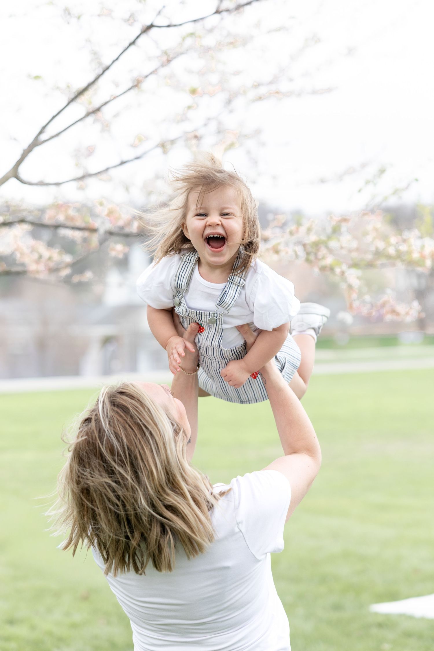 Mother holding her baby during a timeless motherhood session at Carillon Park in Dayton Ohio with Julia and Sean Photography