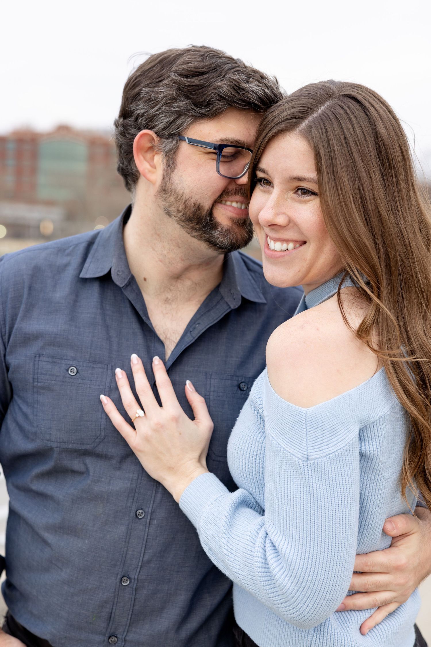 Downtown Columbus engagement photos on Main Street Bridge with a joyful couple in a light and airy style