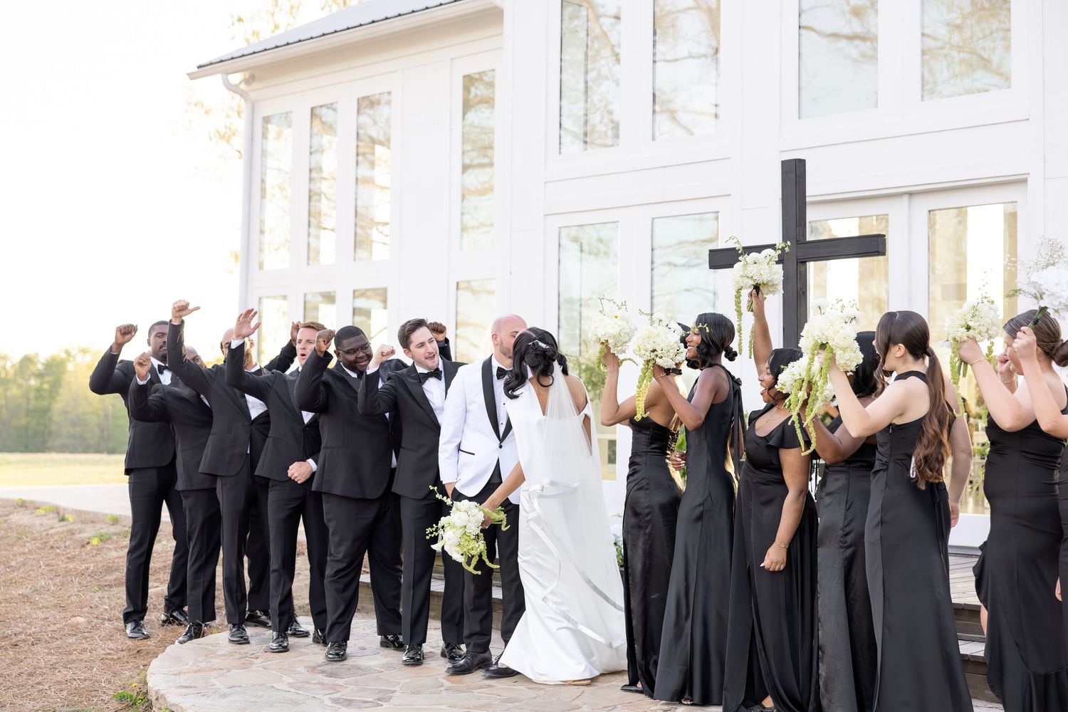 Light and airy wedding photos at The Glass House near Huntsville, Alabama capturing joyful, timeless moments of a bride and groom