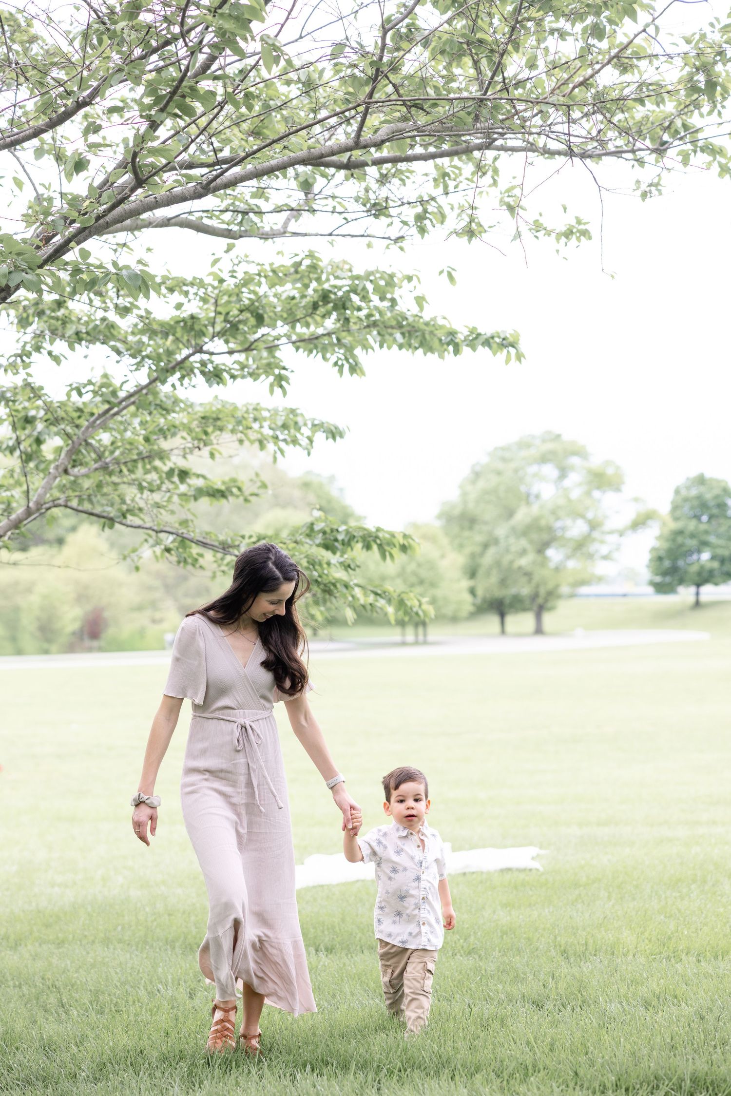 Mother holding her baby during a timeless motherhood session at Carillon Park in Dayton Ohio with Julia and Sean Photography