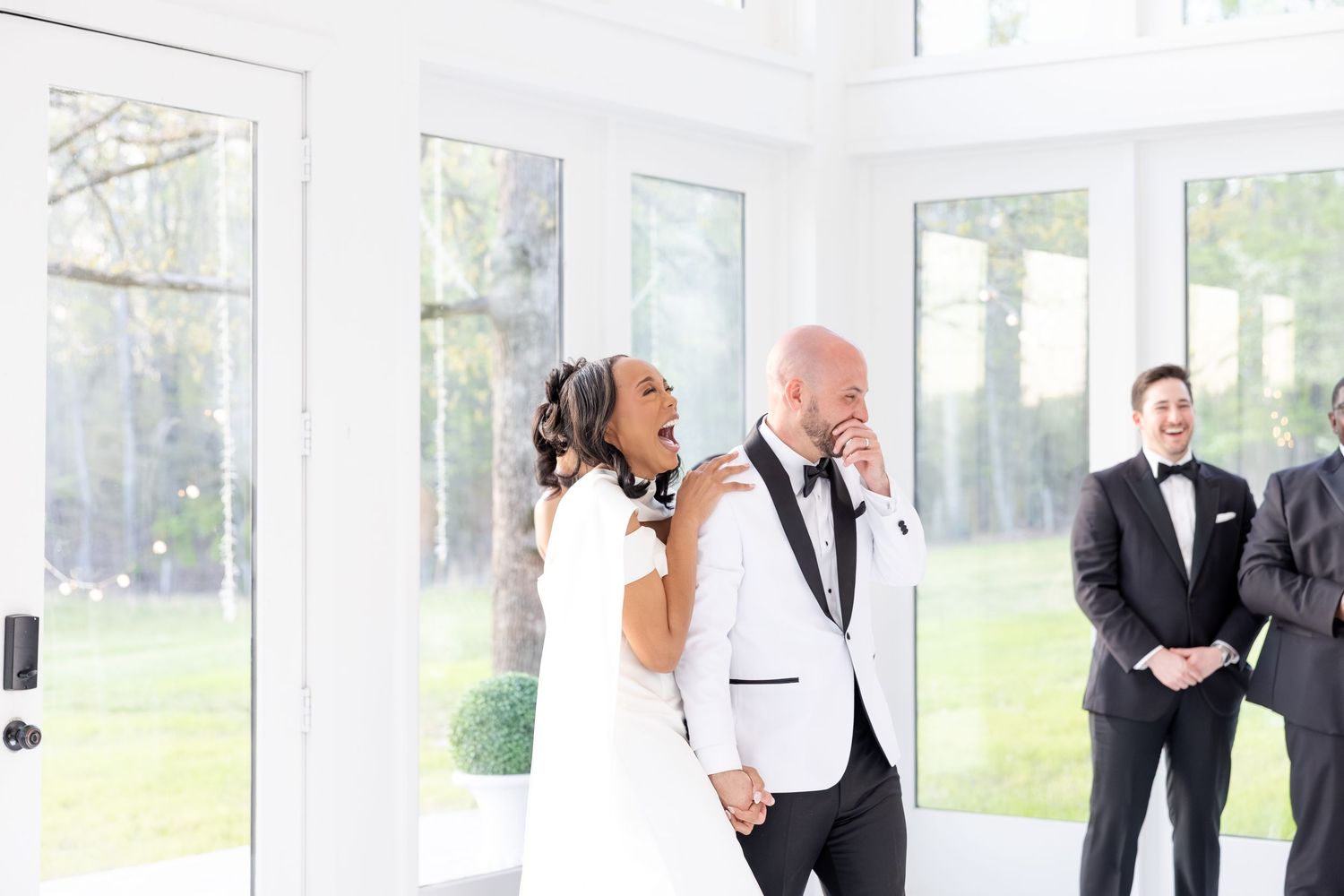 Light and airy wedding photos at The Glass House near Huntsville, Alabama capturing joyful, timeless moments of a bride and groom