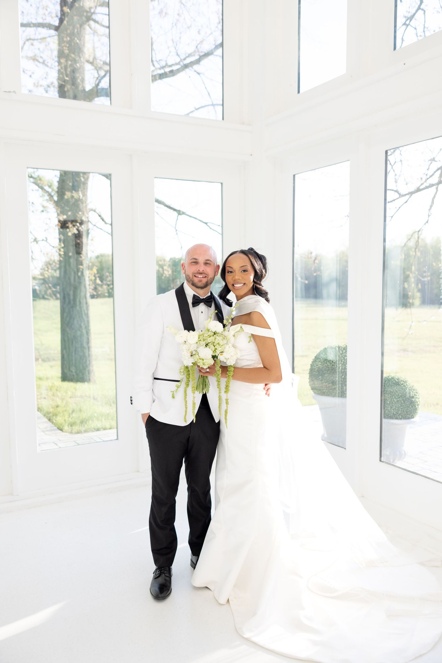 Light and airy wedding photos at The Glass House near Huntsville, Alabama capturing joyful, timeless moments of a bride and groom