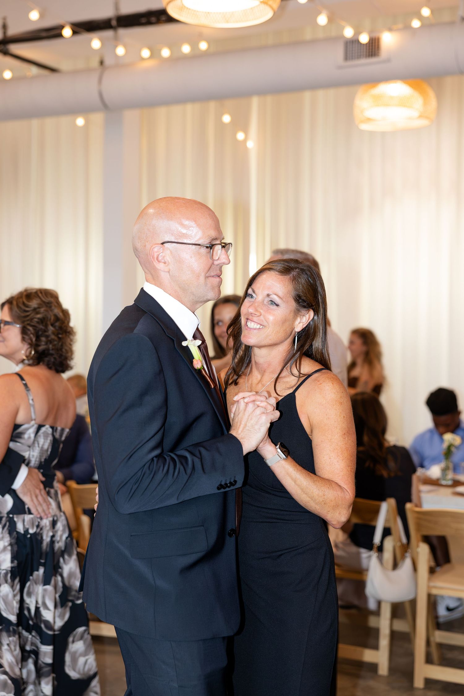 Wedding reception at Flat 51 in downtown Columbus, Ohio, featuring elegant reception details, heartfelt moments, and joyful celebration.