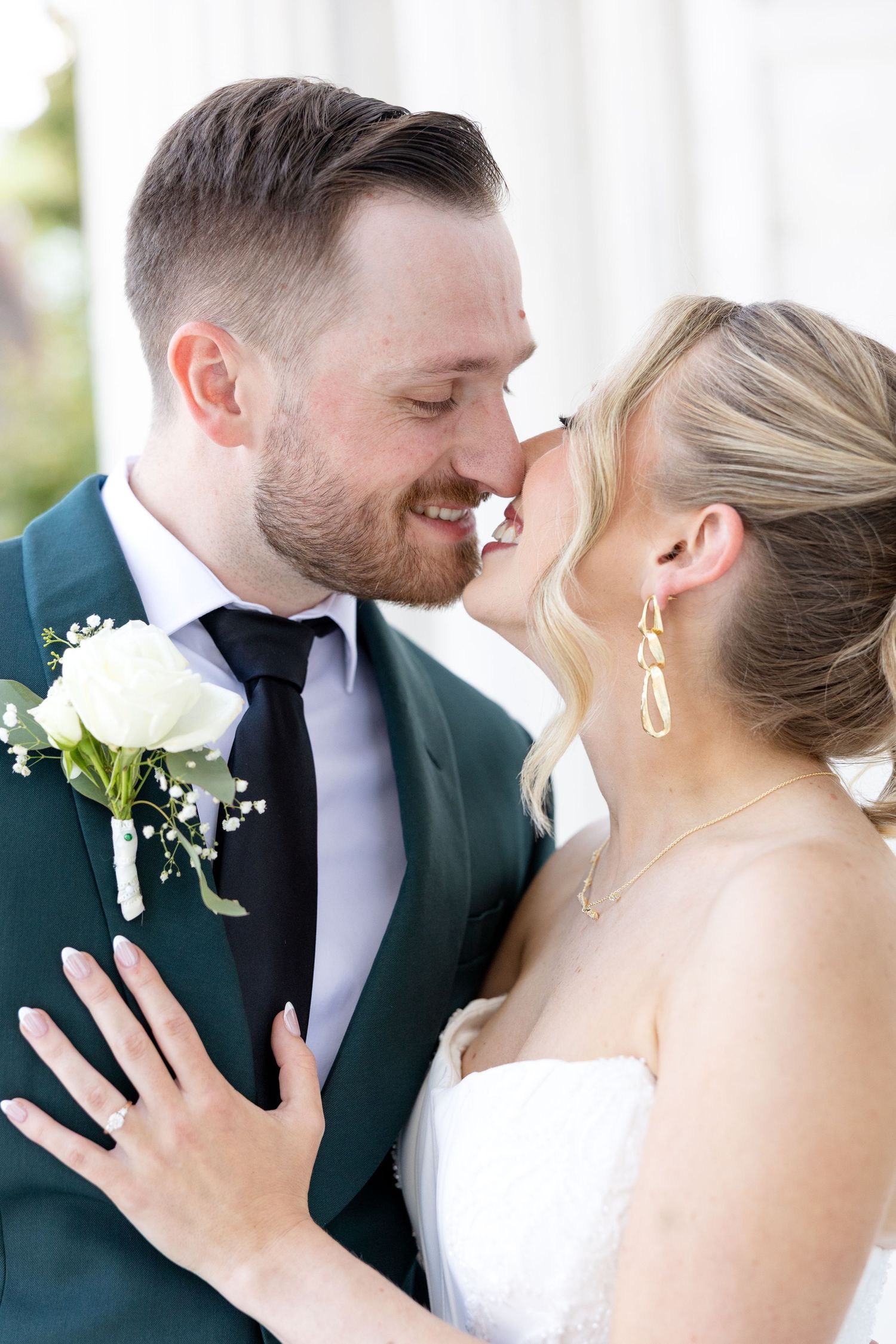 Bride and groom portraits at the Toledo Museum of Art before a Toledo Zoo wedding in Toledo, Ohio photographed by Julia & Sean Photography