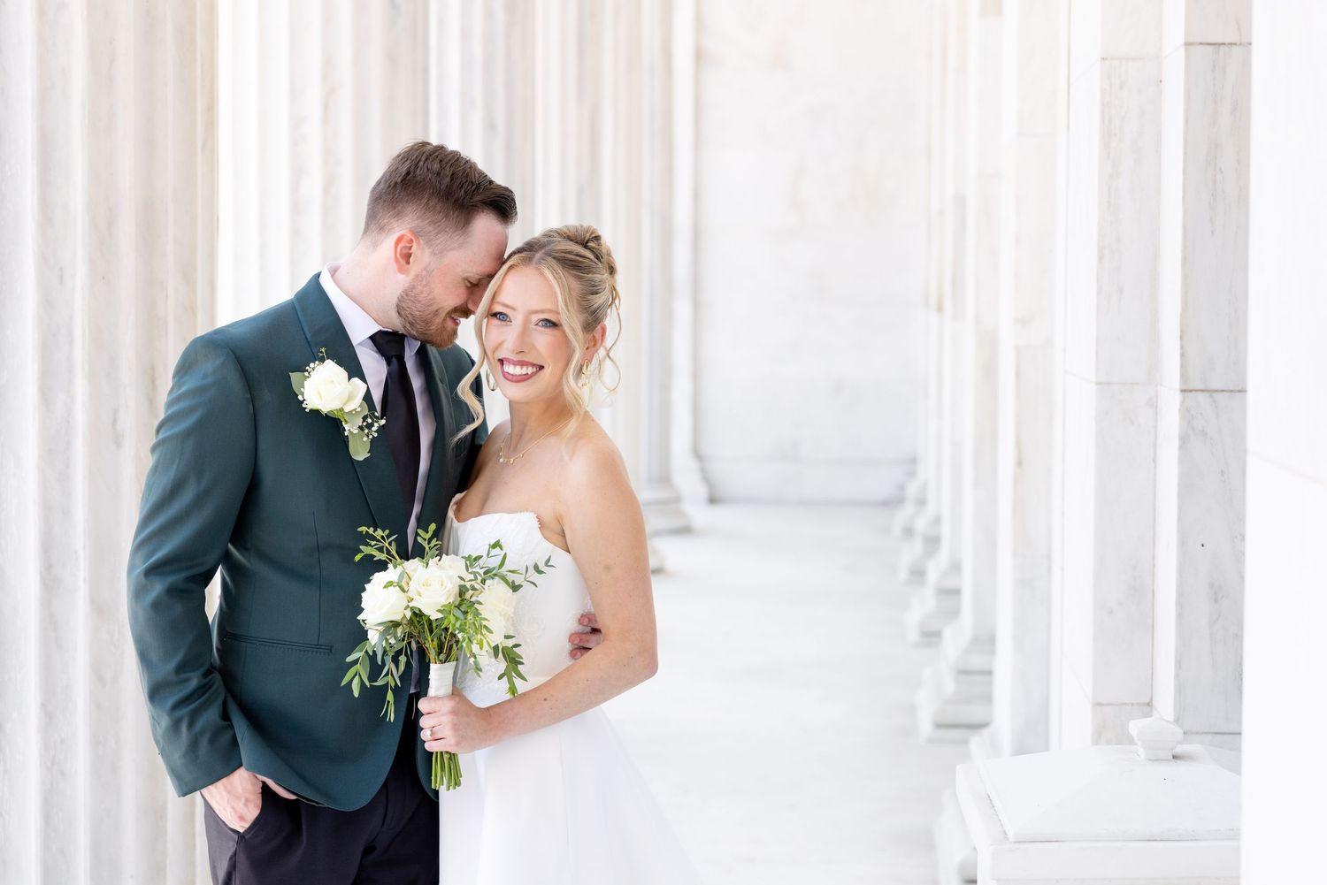 Bride and groom portraits at the Toledo Museum of Art before a Toledo Zoo wedding in Toledo, Ohio photographed by Julia & Sean Photography