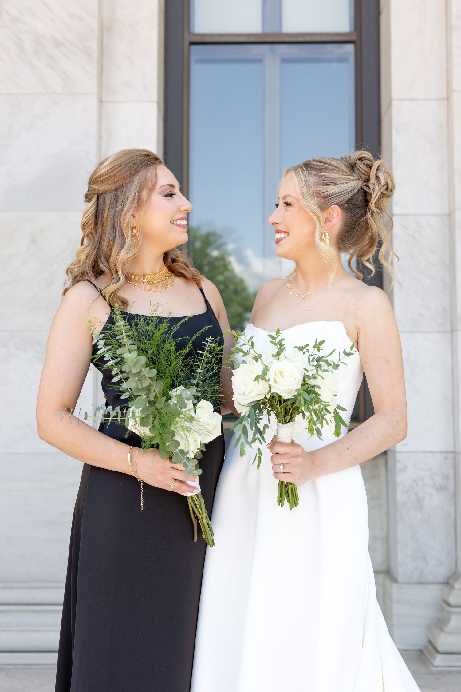 Bride and groom portraits at the Toledo Museum of Art before a Toledo Zoo wedding in Toledo, Ohio photographed by Julia & Sean Photography