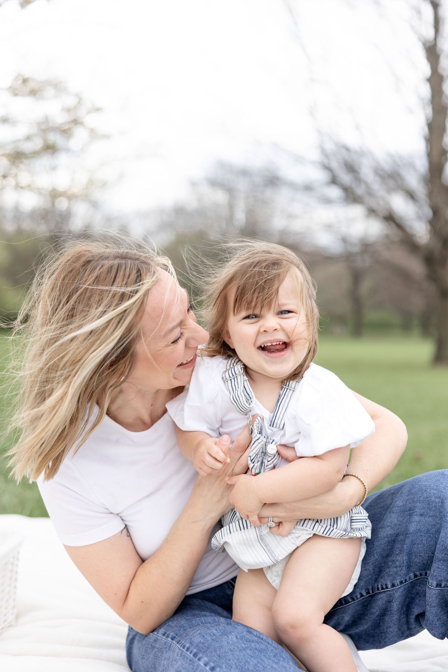 Joyful motherhood photos at Carillon Park in Dayton Ohio captured by Julia and Sean Photography during a soft spring day