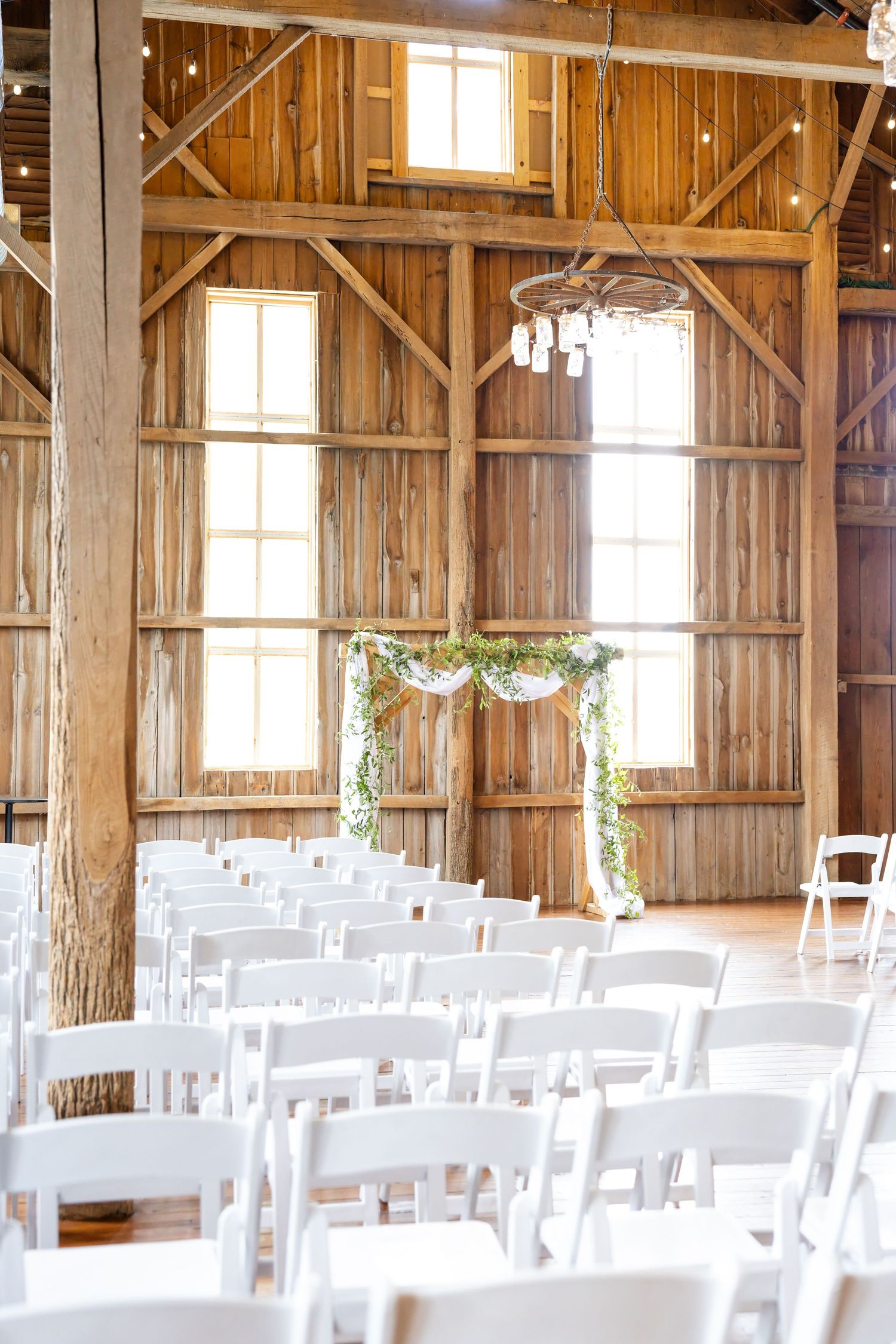 Timeless wedding photography at The Bicentennial Barn in Dayton, Ohio, featuring a joyful Cedarville University couple on their wedding day.