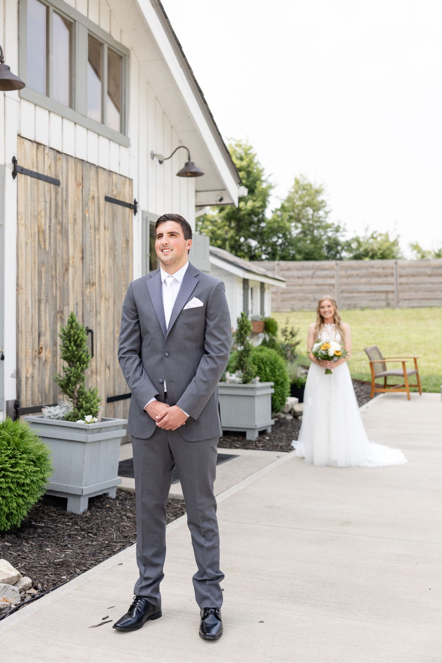 Timeless wedding photography at The Bicentennial Barn in Dayton, Ohio, featuring a joyful Cedarville University couple on their wedding day.