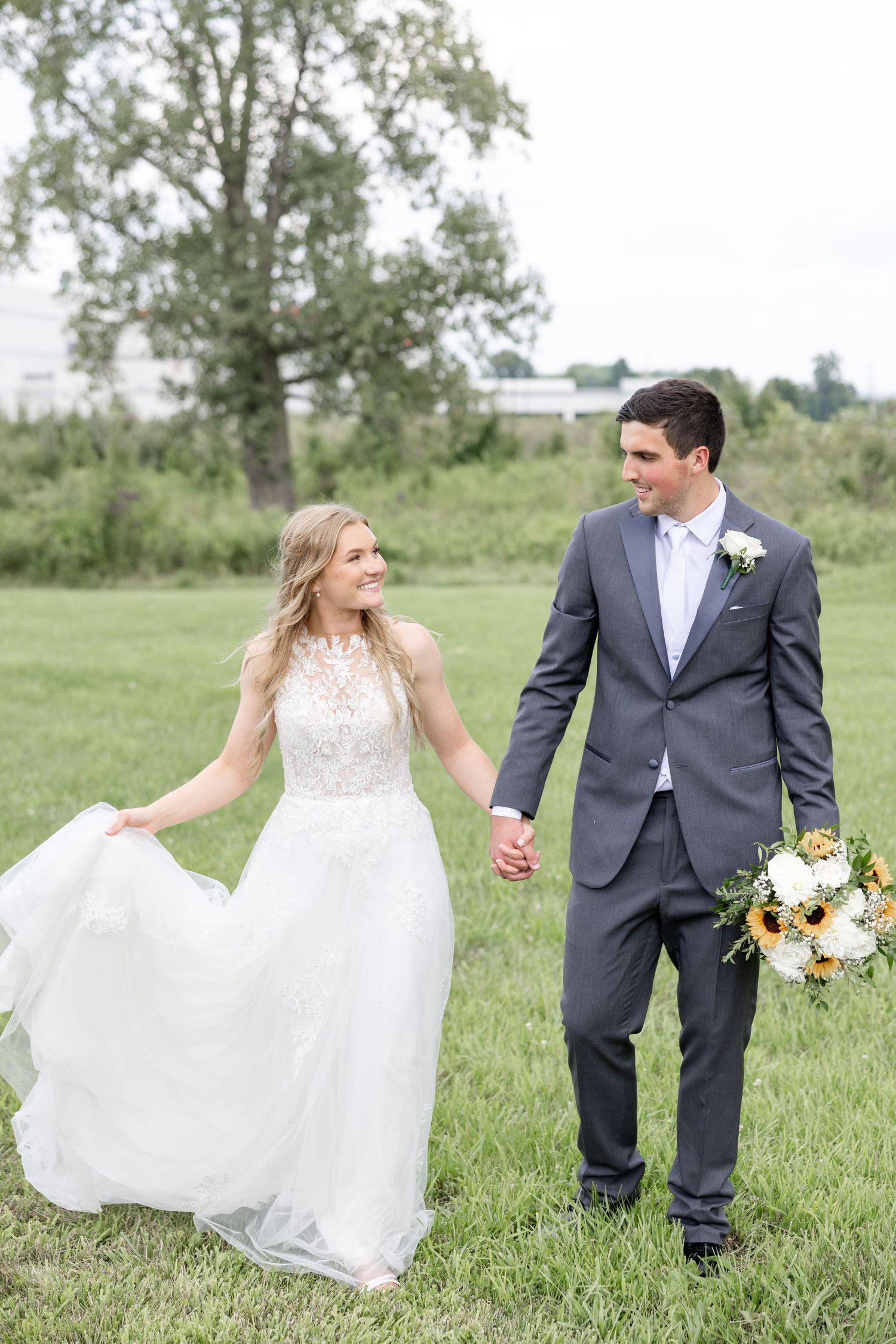 Joyful summer wedding at The Bicentennial Barn in Dayton, Ohio, photographed by Dayton wedding photographers Julia and Sean Photography.