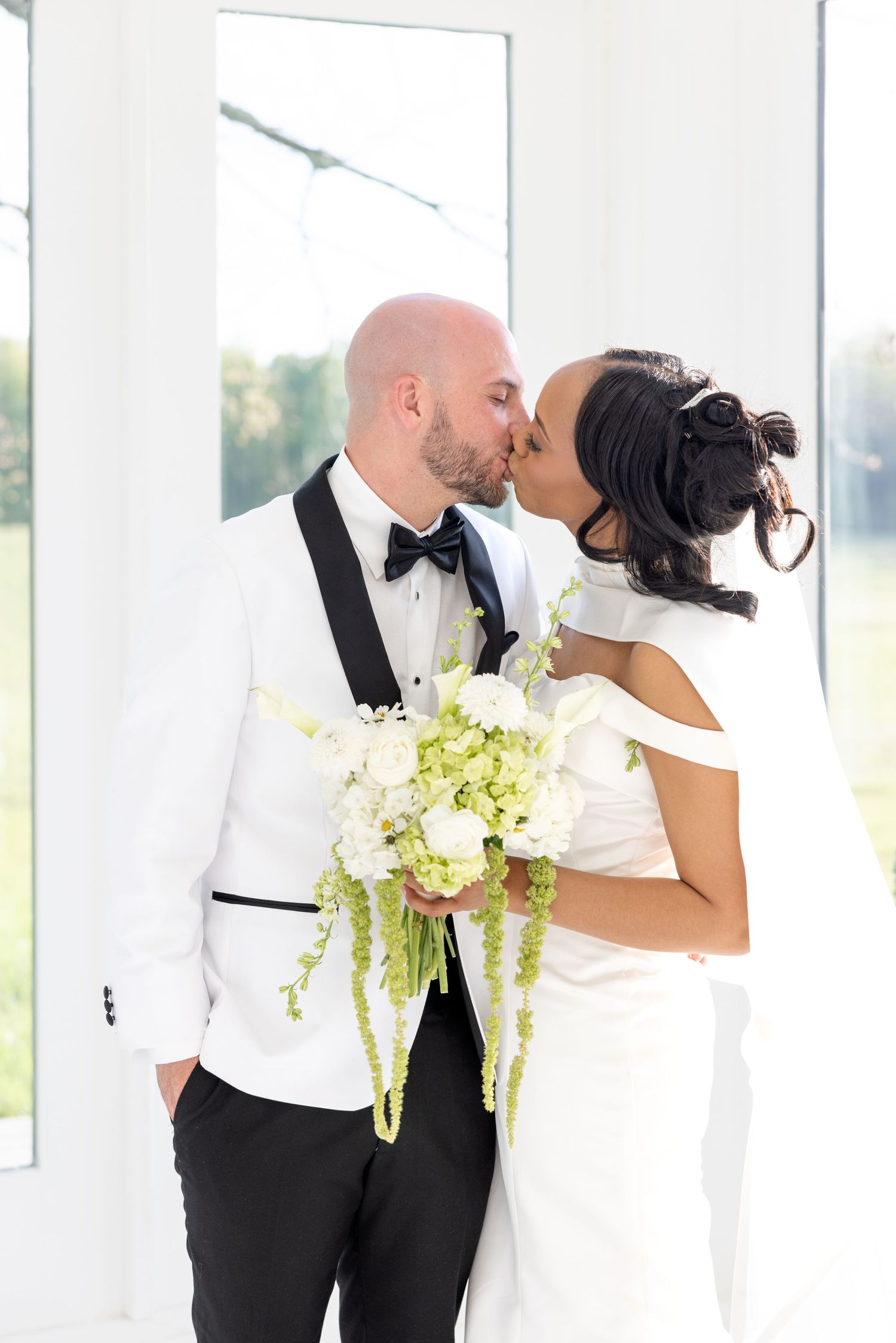 Light and airy wedding photos at The Glass House near Huntsville, Alabama capturing joyful, timeless moments of a bride and groom