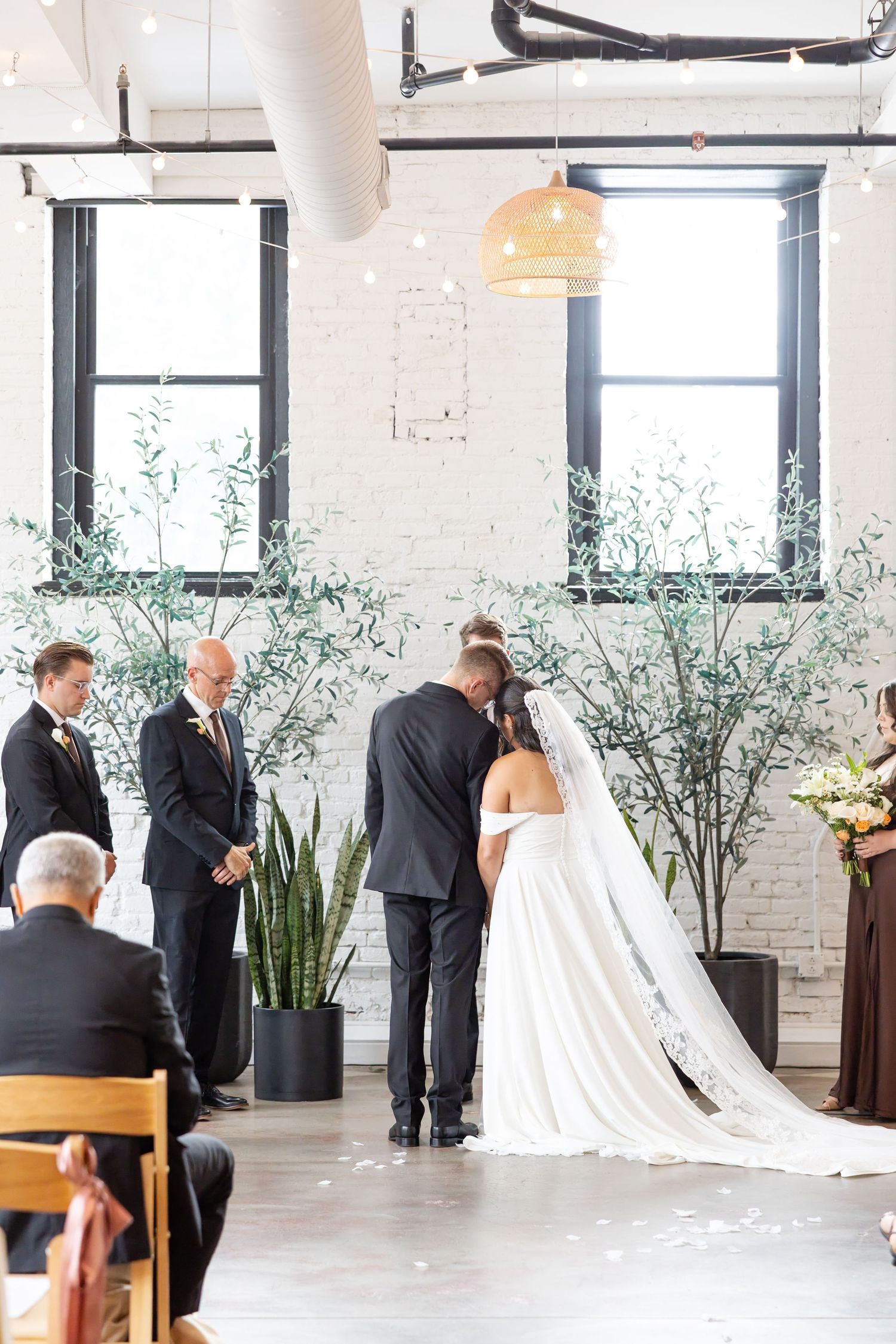 Bride and groom celebrating their Flat 51 wedding in downtown Columbus, Ohio, captured with timeless, light and airy wedding photography.