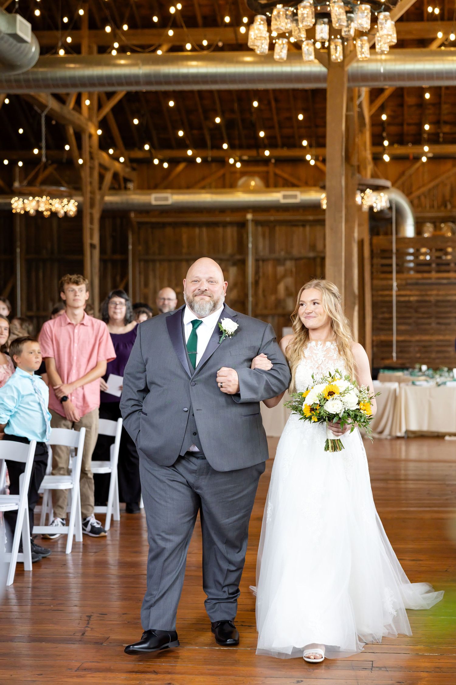 Timeless wedding photography at The Bicentennial Barn in Dayton, Ohio, featuring a joyful Cedarville University couple on their wedding day.