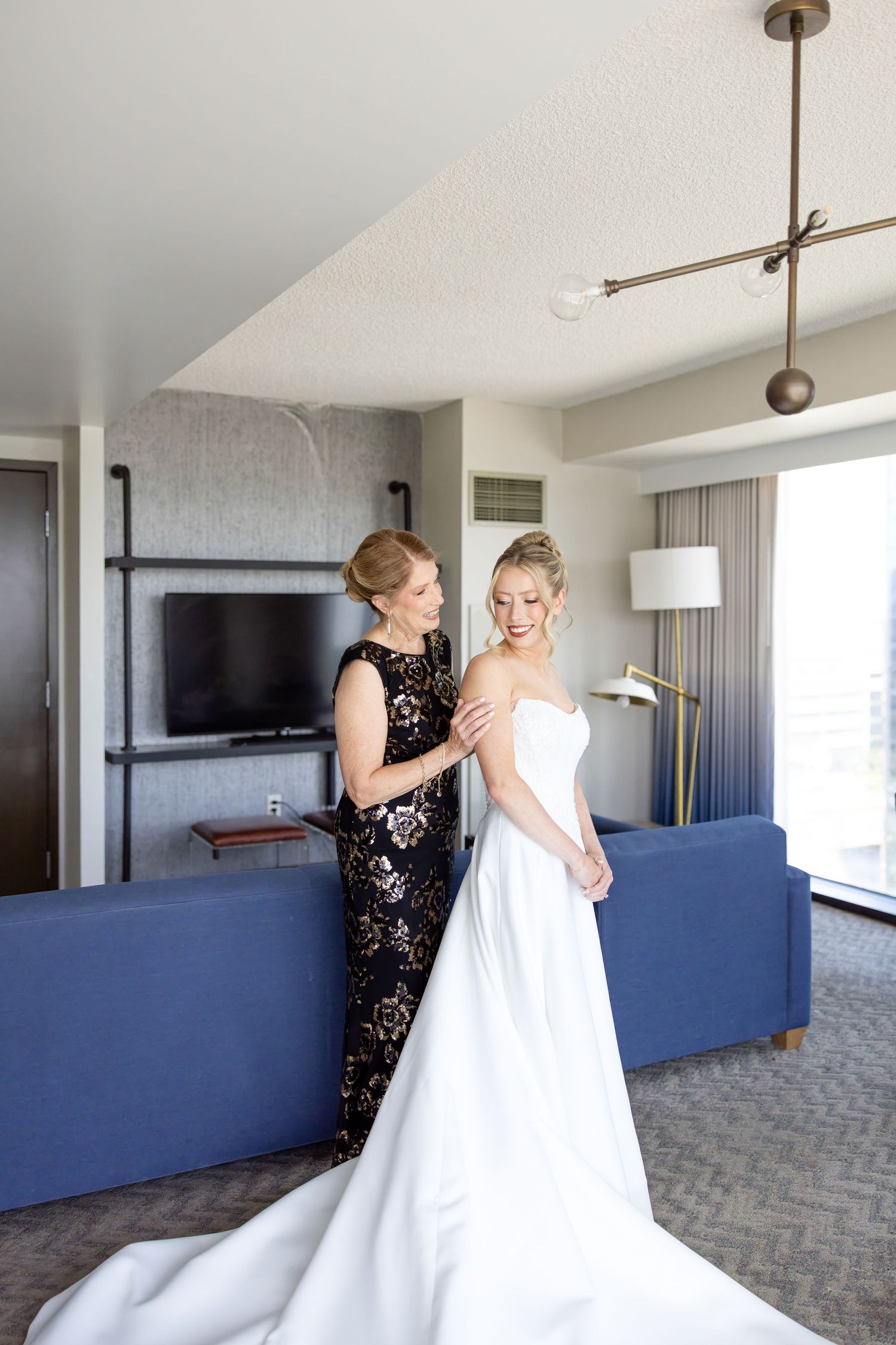 Getting ready photos at The Renaissance Hotel in downtown Toledo before a joyful Toledo Zoo wedding photographed by Julia & Sean Photography
