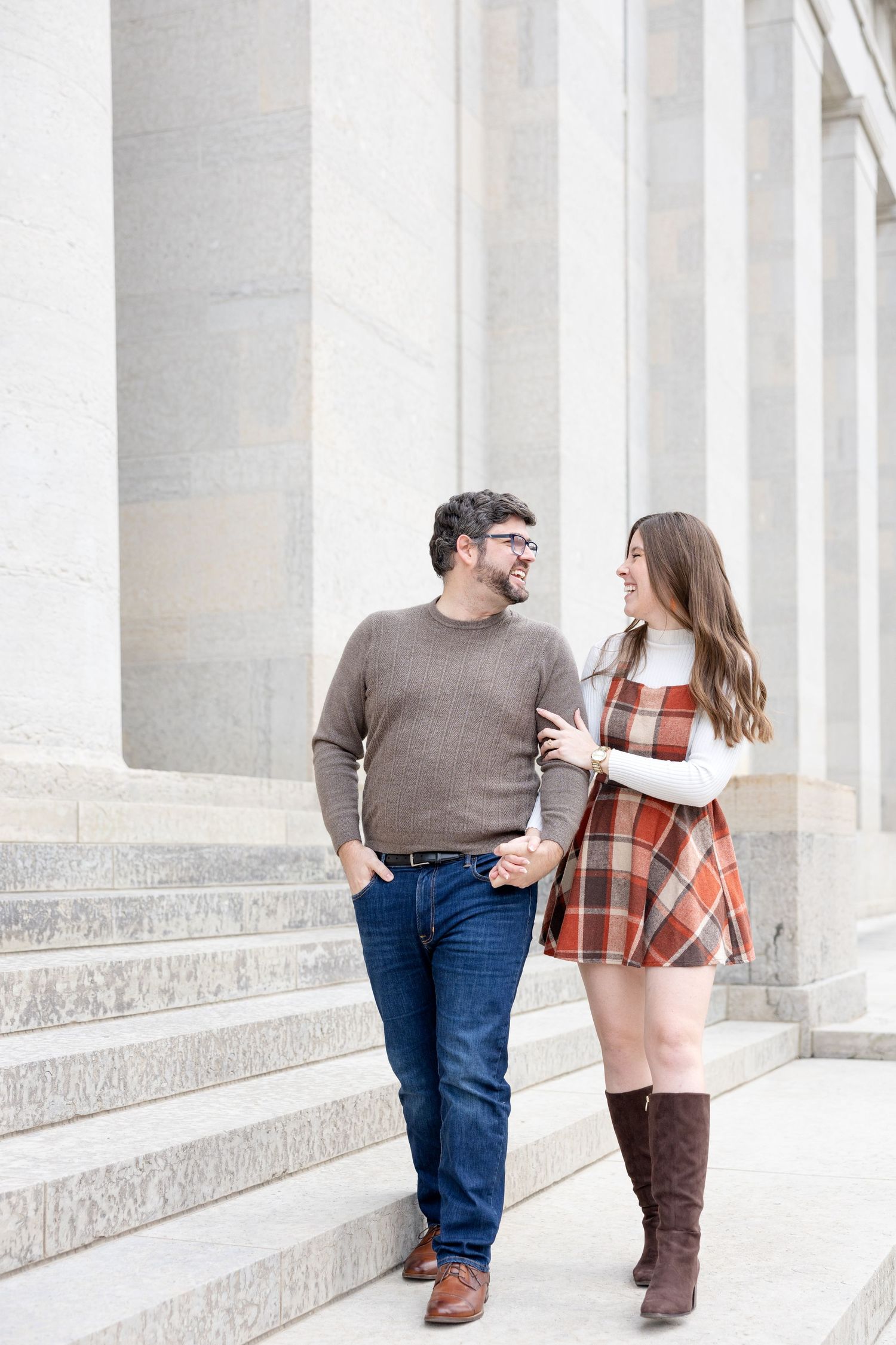 Ohio Statehouse engagement photos in downtown Columbus Ohio with a joyful couple in a light and airy style