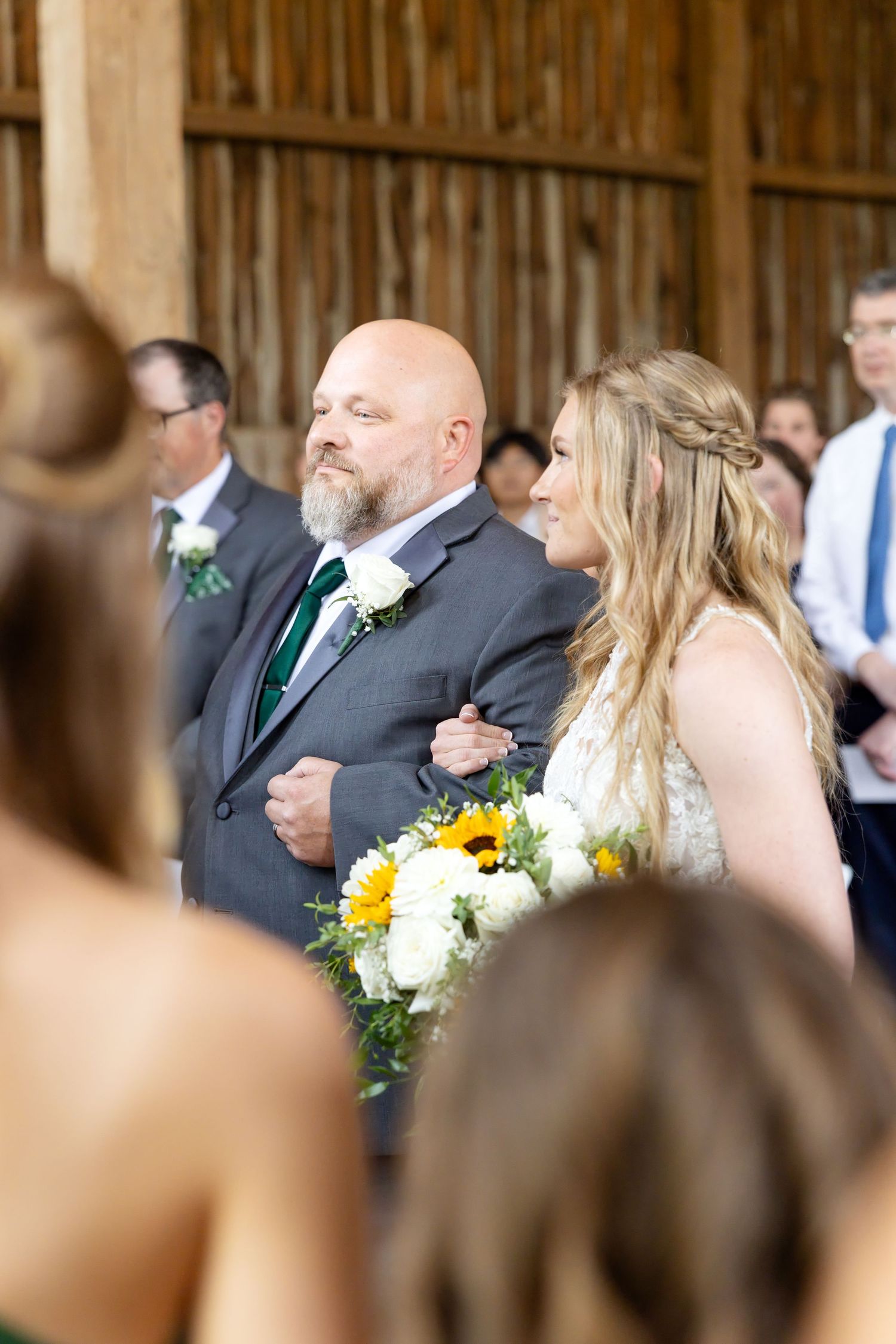 Timeless wedding photography at The Bicentennial Barn in Dayton, Ohio, featuring a joyful Cedarville University couple on their wedding day.