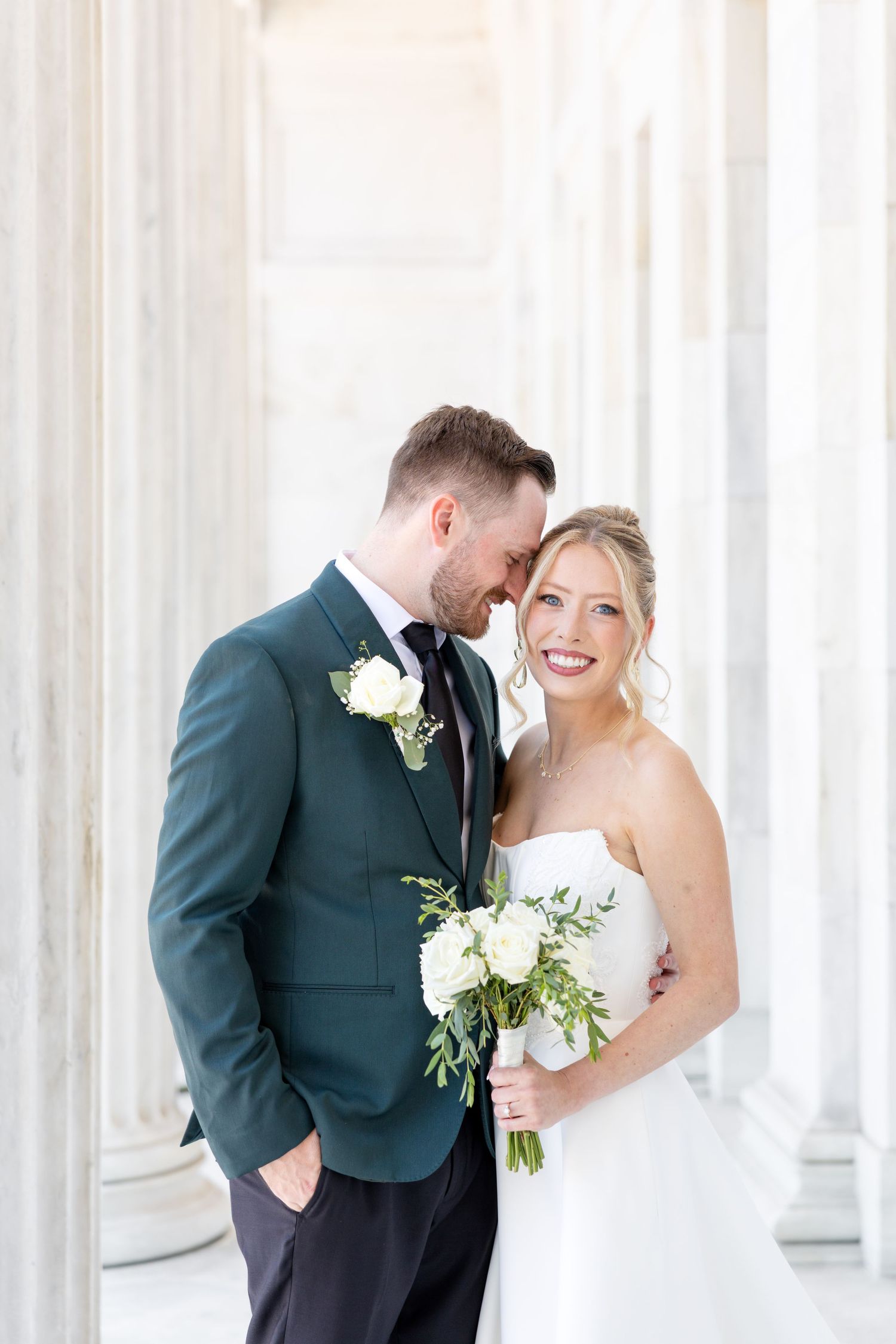 Bride and groom portraits at the Toledo Museum of Art before a Toledo Zoo wedding in Toledo, Ohio photographed by Julia & Sean Photography