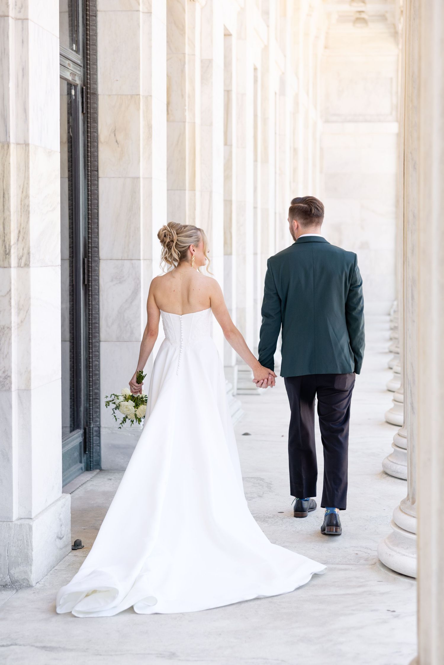 Bride and groom portraits at the Toledo Museum of Art before a Toledo Zoo wedding in Toledo, Ohio photographed by Julia & Sean Photography