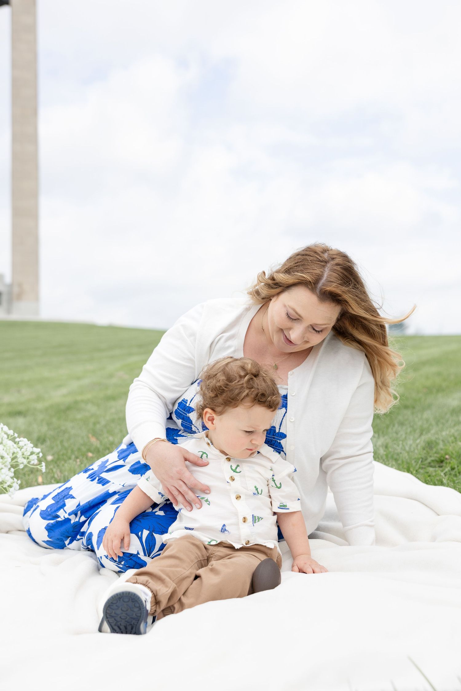 Mother holding her baby during a timeless motherhood session at Carillon Park in Dayton Ohio with Julia and Sean Photography