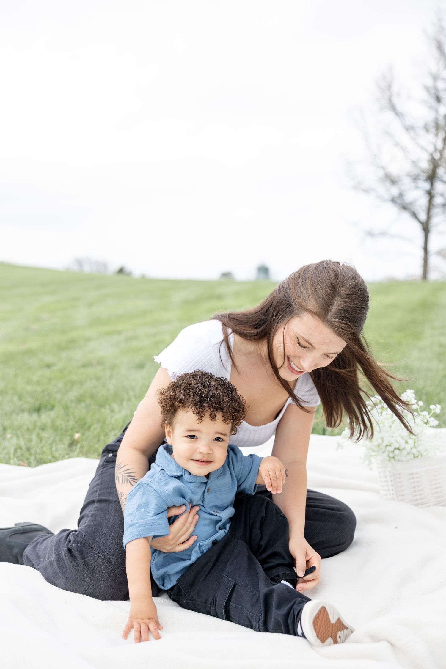 Joyful motherhood photos at Carillon Park in Dayton Ohio captured by Julia and Sean Photography during a soft spring day