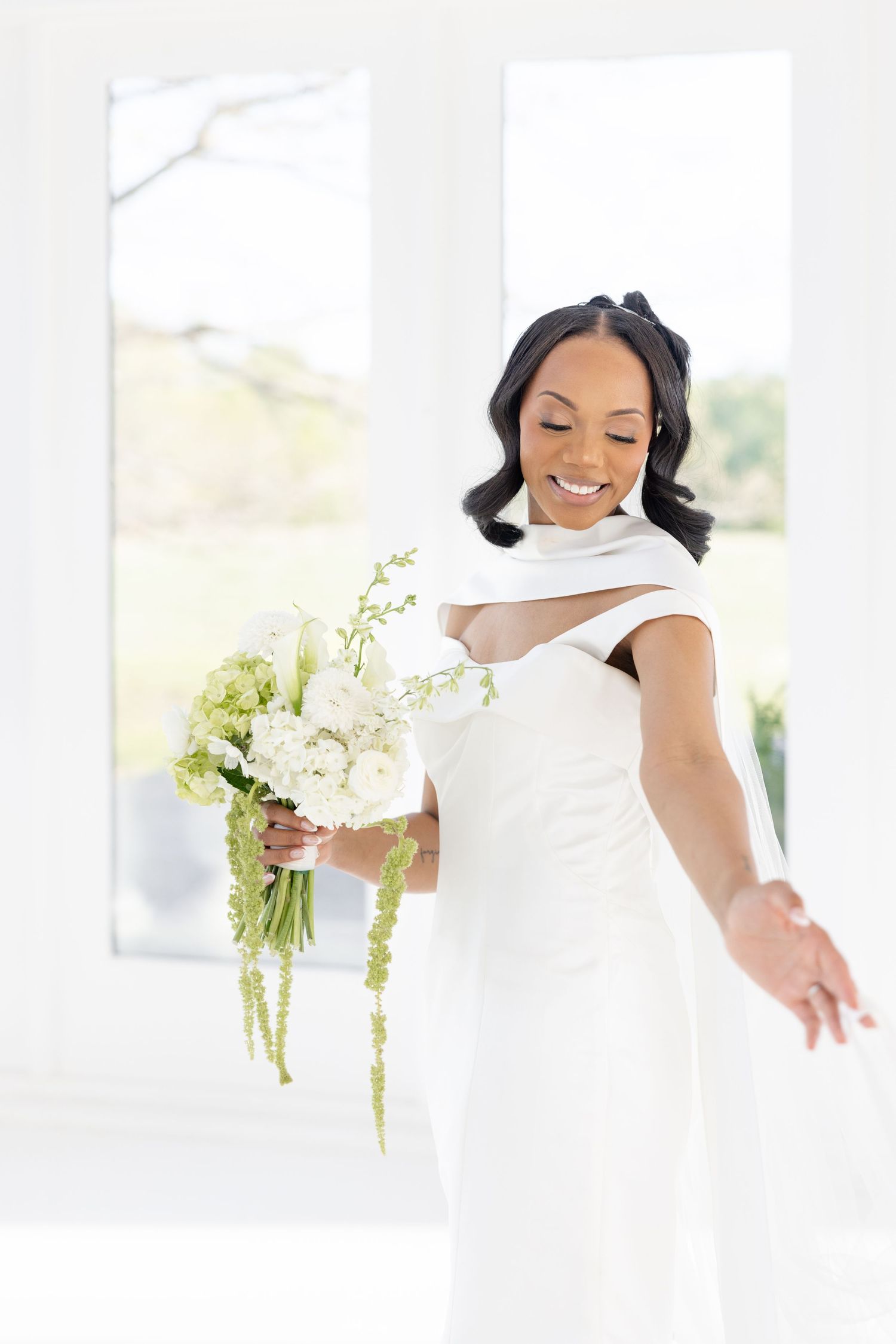 Light and airy wedding photos at The Glass House near Huntsville, Alabama capturing joyful, timeless moments of a bride and groom