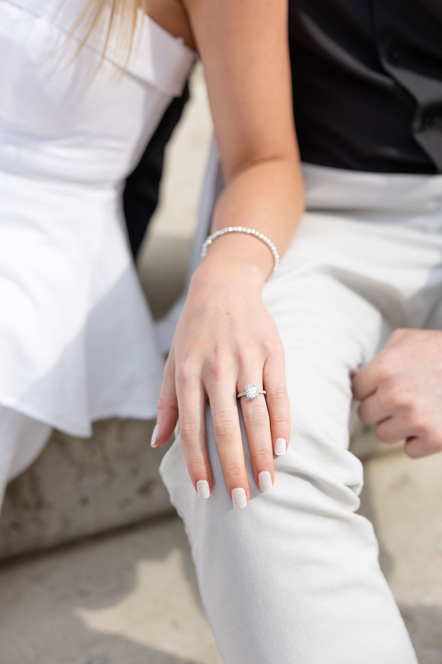 Light and airy engagement photos of a joyful couple at the Ohio Statehouse in downtown Columbus, Ohio captured by Julia and Sean Photography