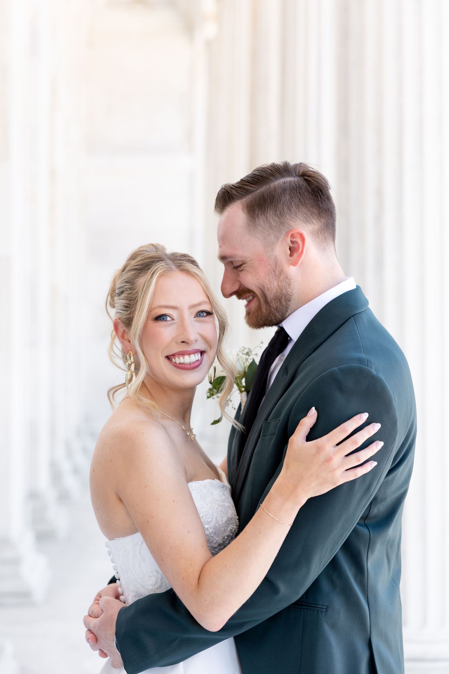 Bride and groom portraits at the Toledo Museum of Art before a Toledo Zoo wedding in Toledo, Ohio photographed by Julia & Sean Photography