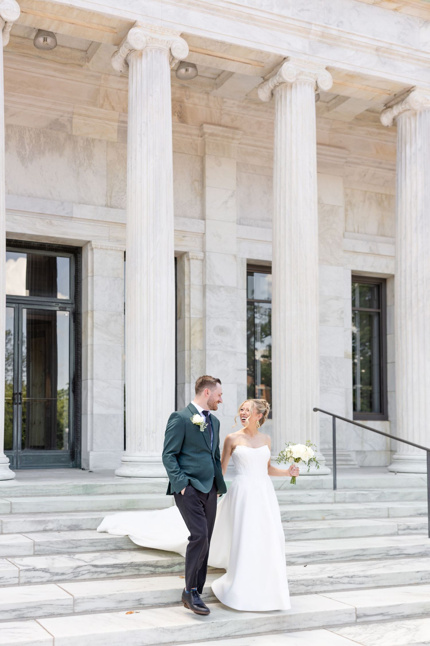 Bride and groom portraits at the Toledo Museum of Art before a Toledo Zoo wedding in Toledo, Ohio photographed by Julia & Sean Photography