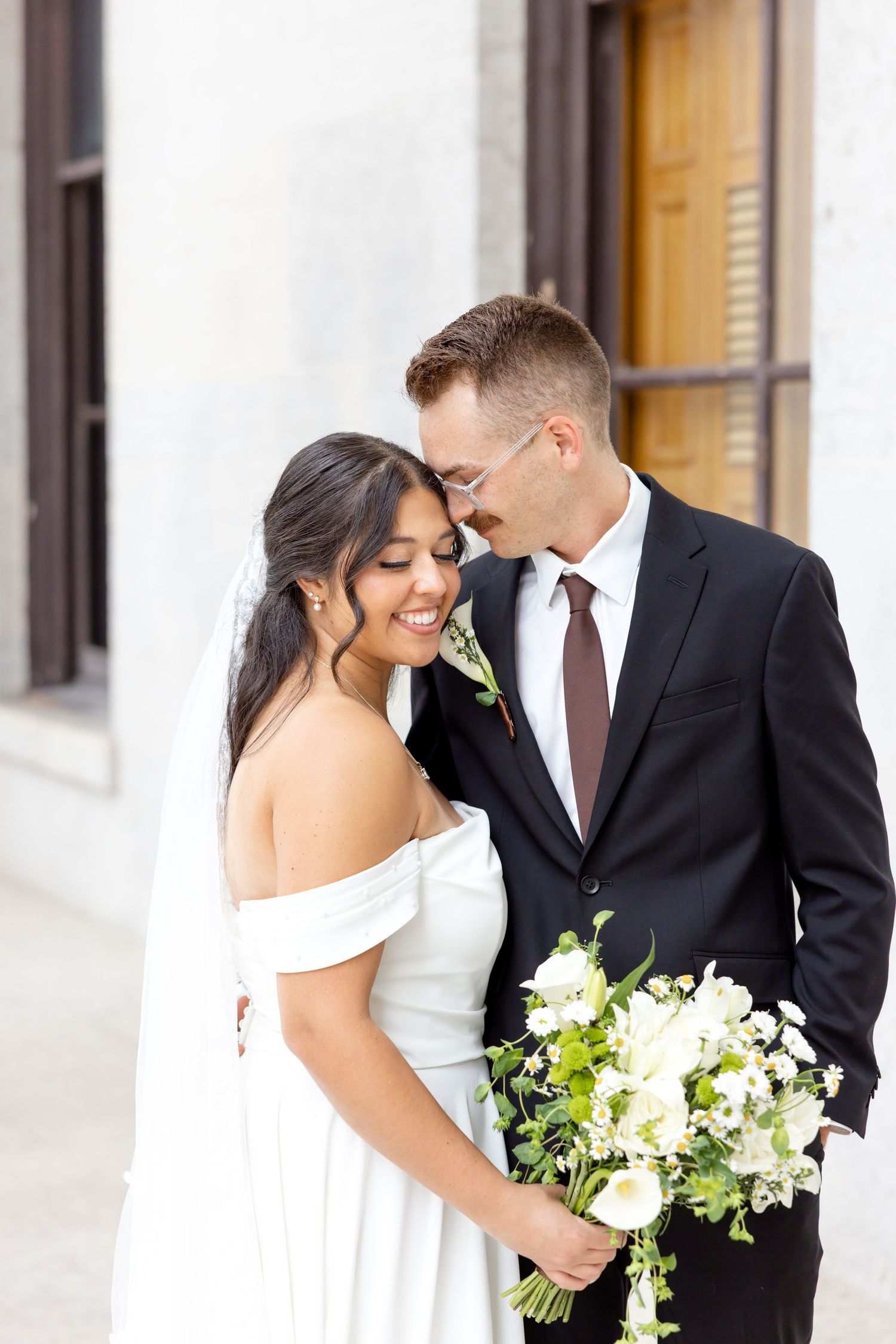 Bride and groom portraits at the Ohio Statehouse in downtown Columbus, Ohio, captured with timeless, light and airy wedding photography.