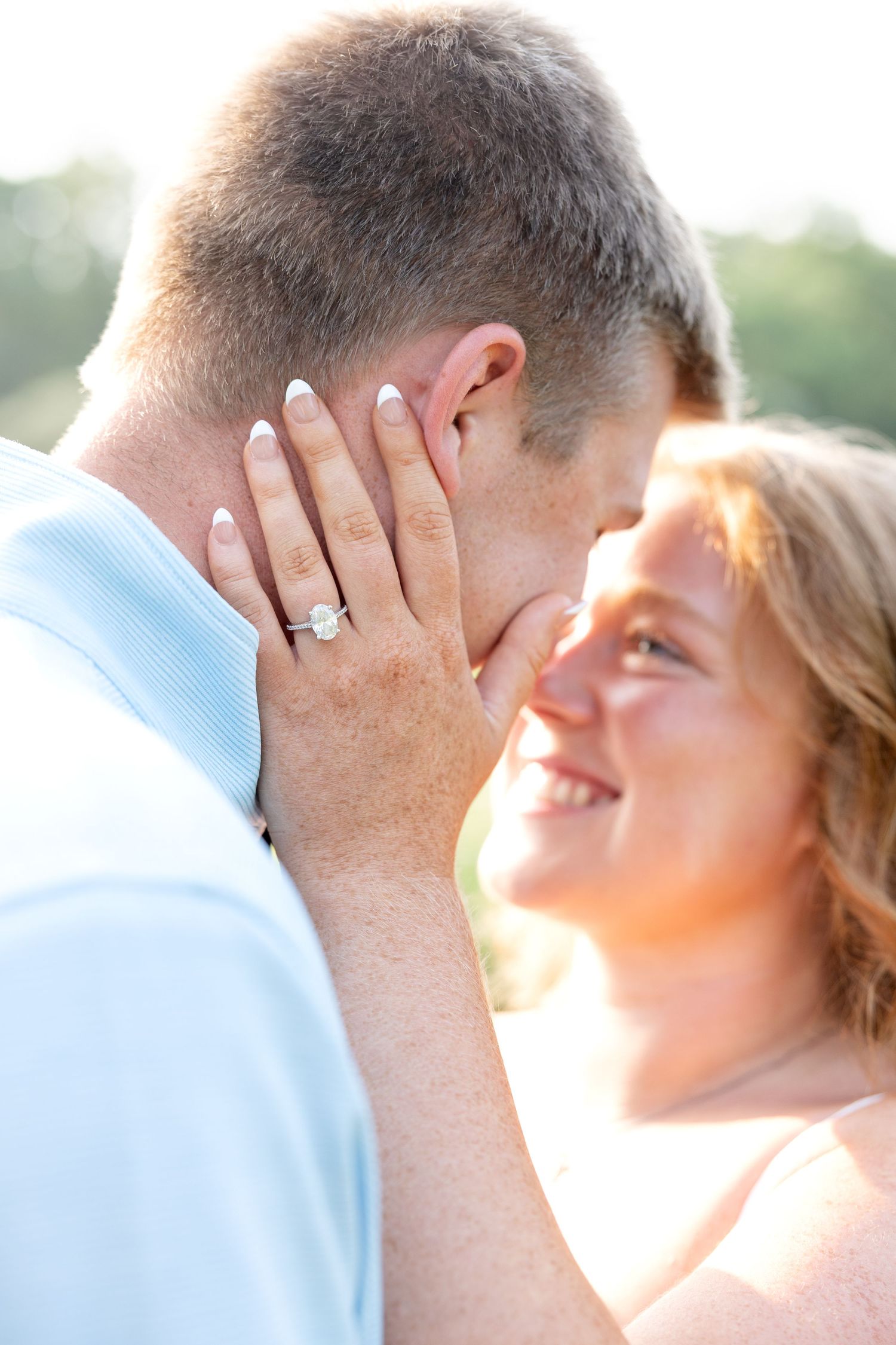 Wegerzyn Gardens engagement session in Dayton, Ohio featuring a joyful couple enjoying soft morning light and timeless engagement photos.