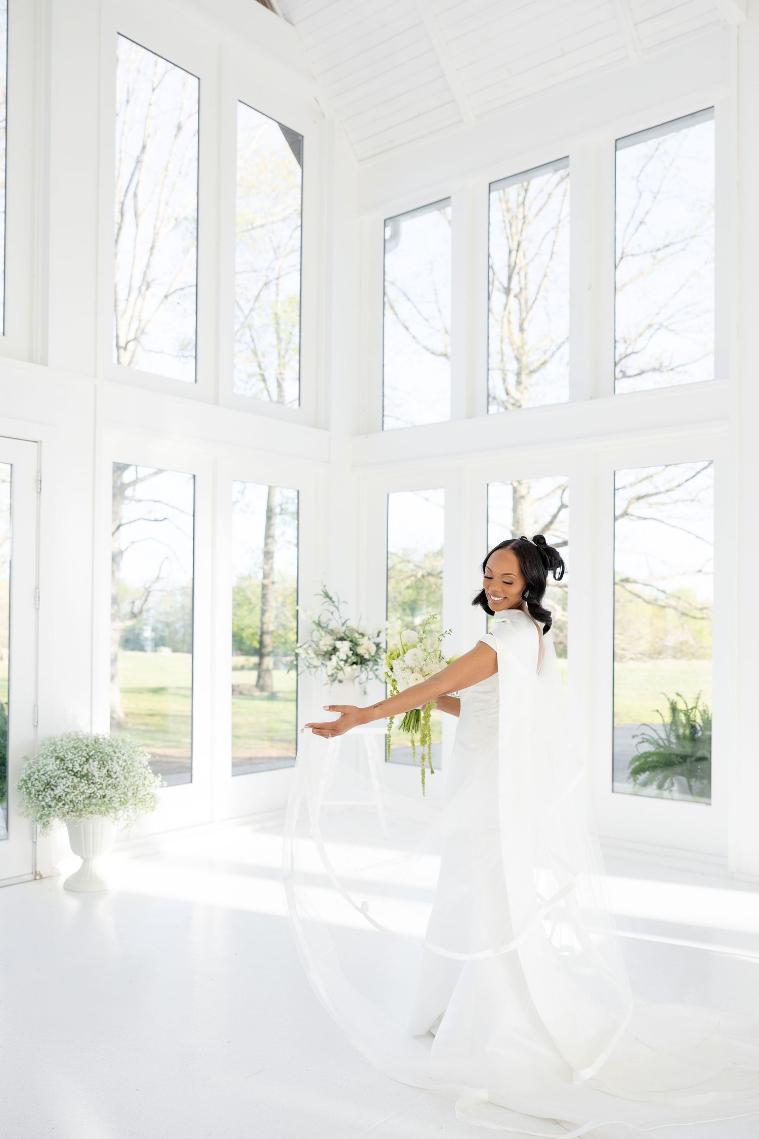 Light and airy wedding photos at The Glass House near Huntsville, Alabama capturing joyful, timeless moments of a bride and groom