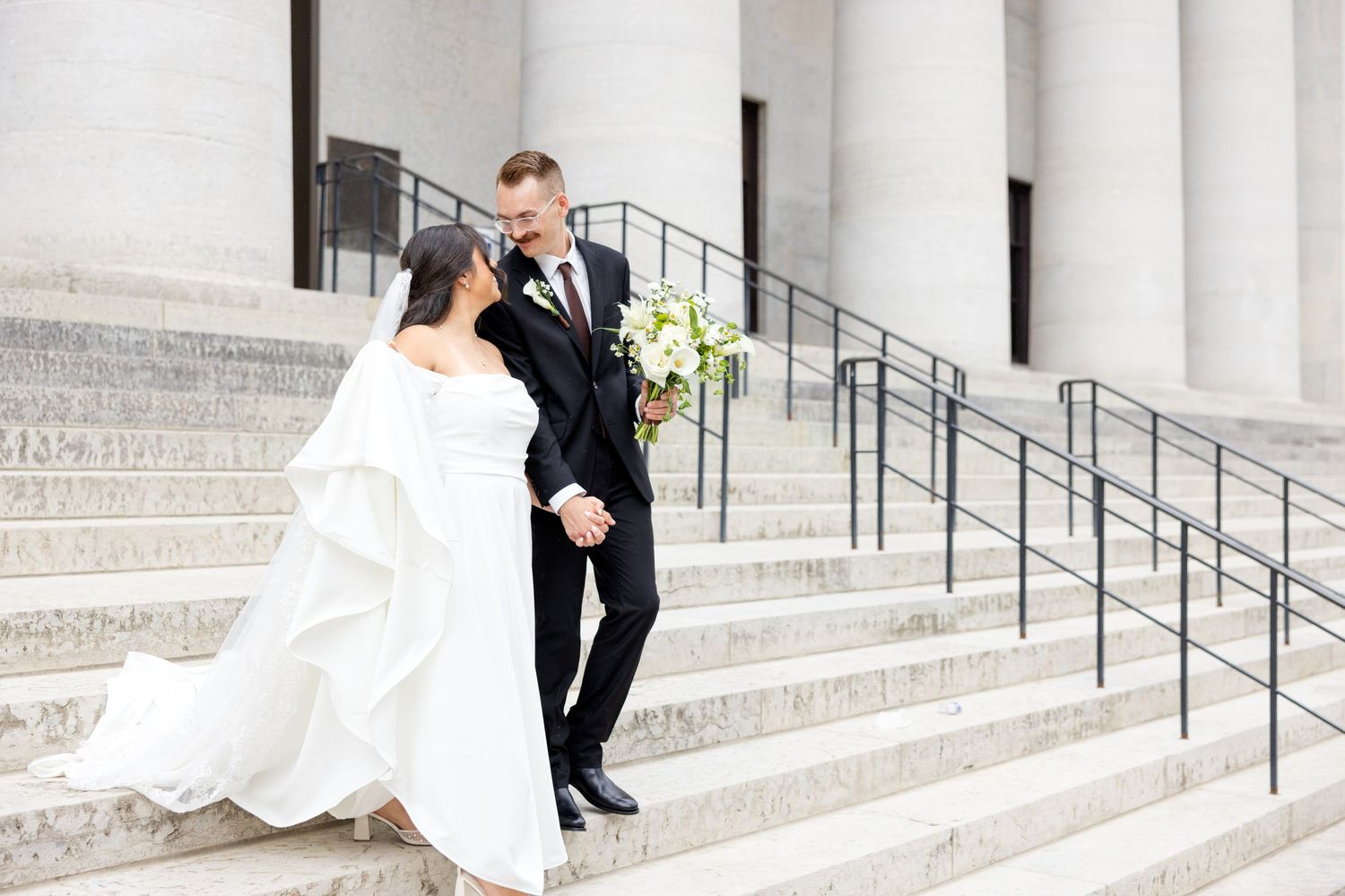 Bride and groom portraits at the Ohio Statehouse in downtown Columbus, Ohio, captured with timeless, light and airy wedding photography.