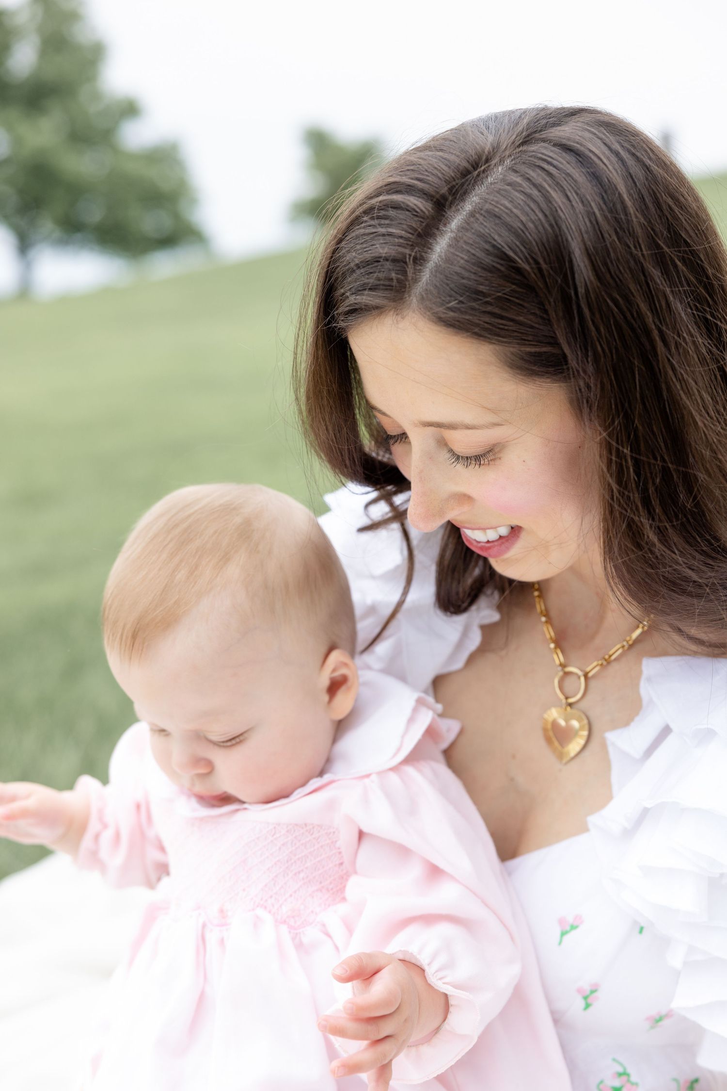 Joyful motherhood photos at Carillon Park in Dayton Ohio captured by Julia and Sean Photography during a soft spring day