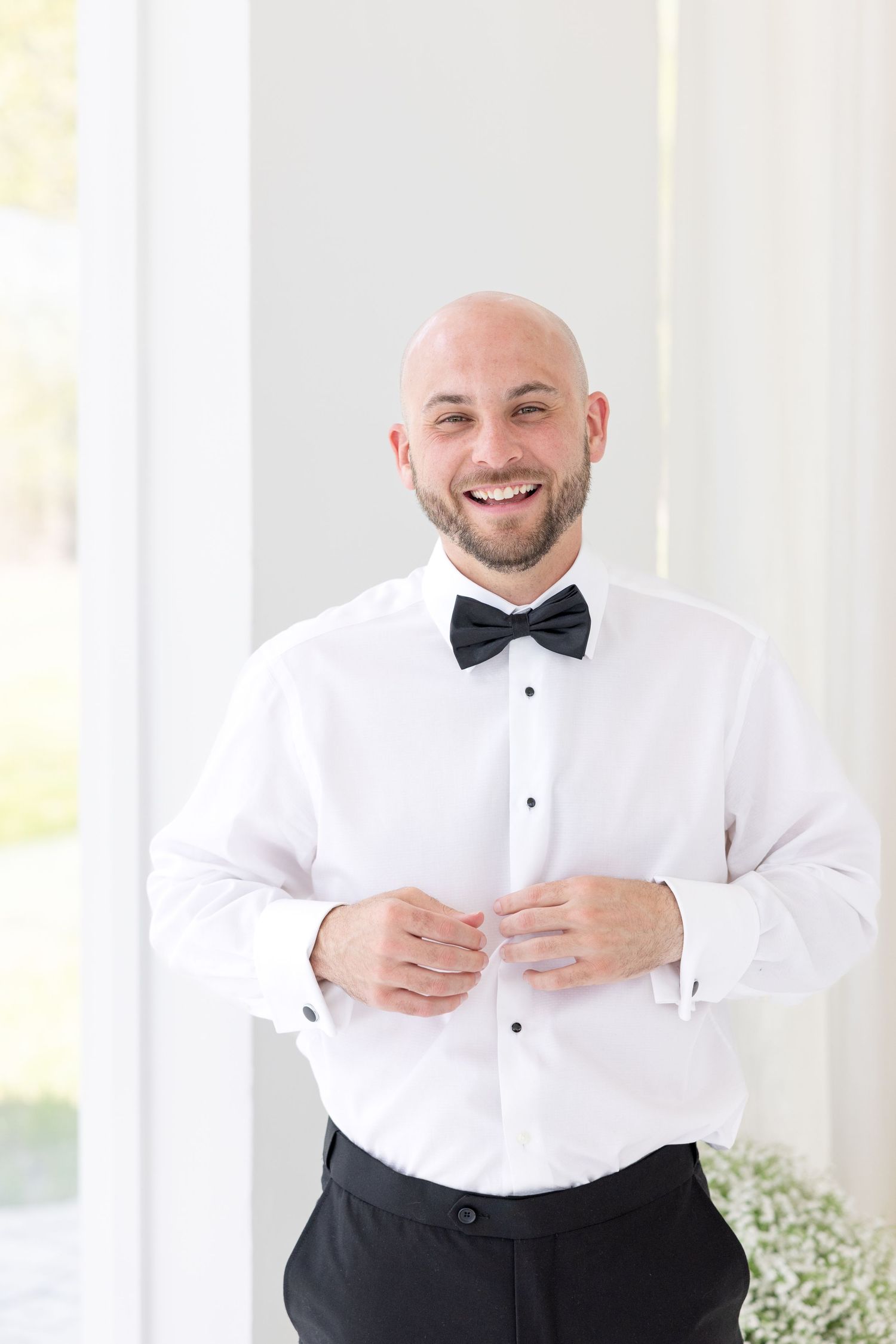 Light and airy wedding photos at The Glass House near Huntsville, Alabama capturing joyful, timeless moments of a bride and groom