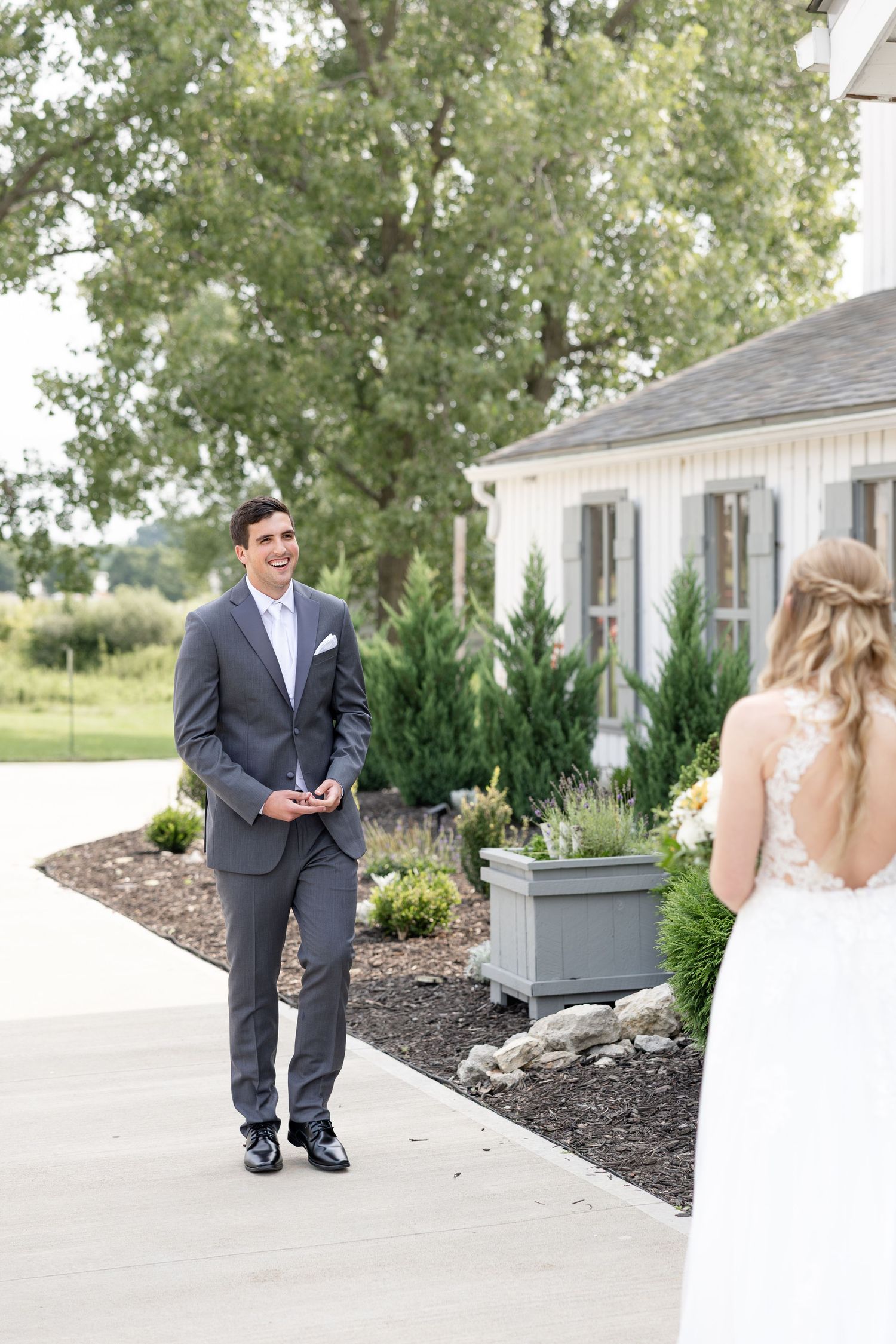 Timeless wedding photography at The Bicentennial Barn in Dayton, Ohio, featuring a joyful Cedarville University couple on their wedding day.