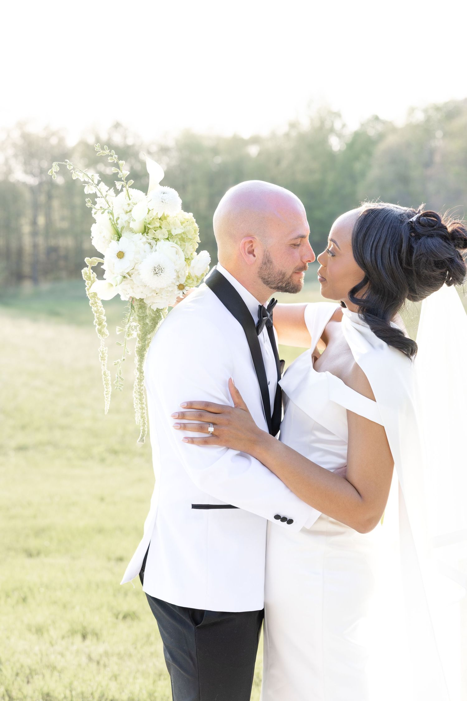 Light and airy wedding photos at The Glass House near Huntsville, Alabama capturing joyful, timeless moments of a bride and groom